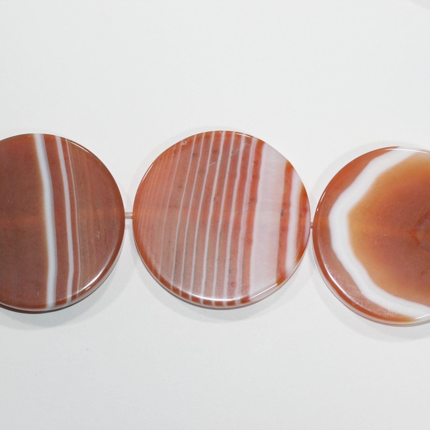 14" St Carnelian Striped Smooth Coin Beads 38x6mm.-Strand 38cm