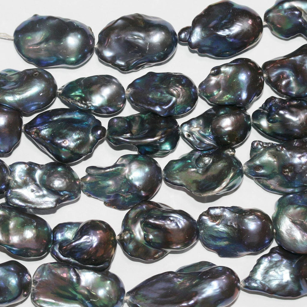 Perla Barroca Gris de Agua Dulce de 16" (24 x 15 mm). Hilo aproximado de 40 cm. Precios al por mayor.