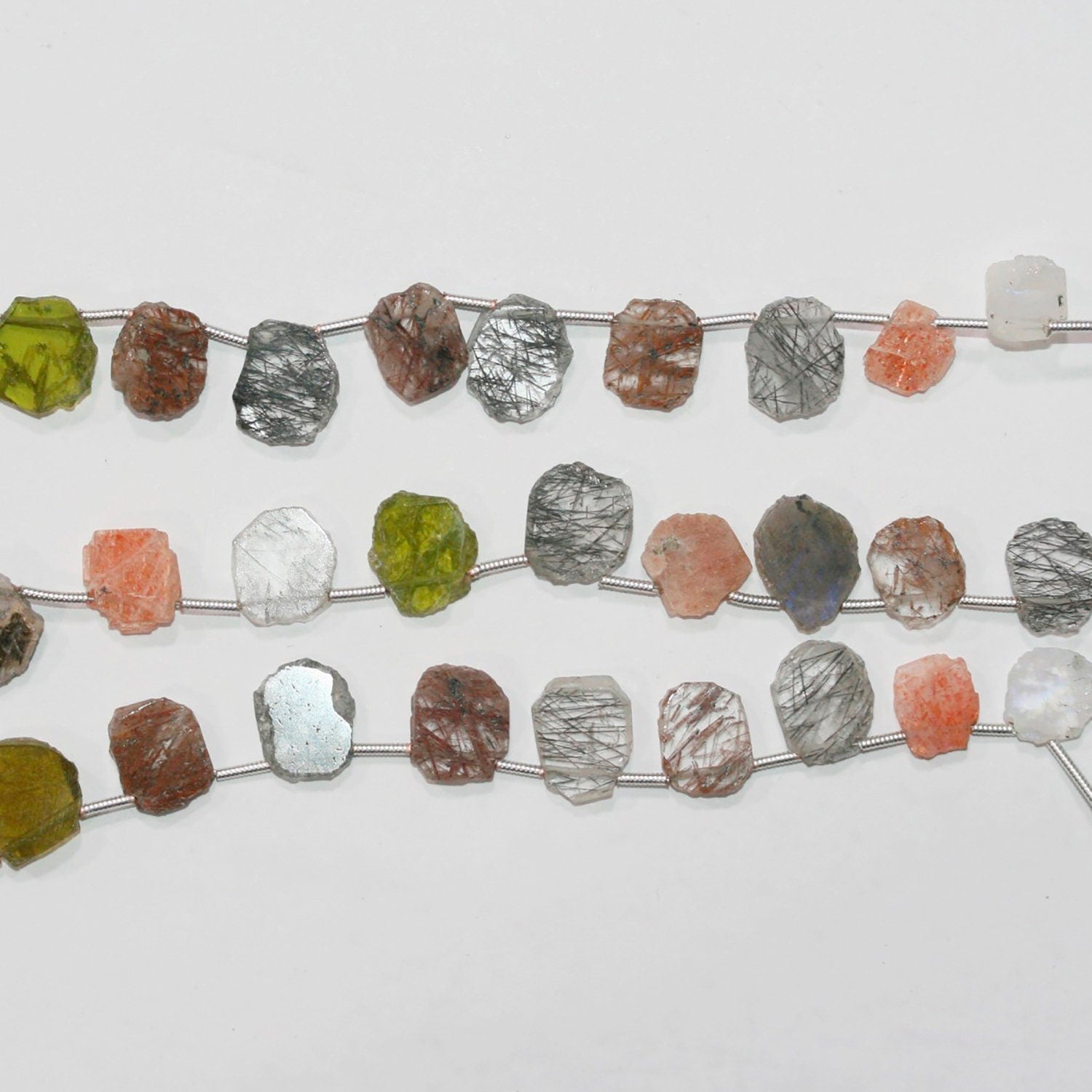 Perles ovales irrégulières lisses en pierre multiple de 8 pouces, 9-10 mm. - Brin de 21 cm.