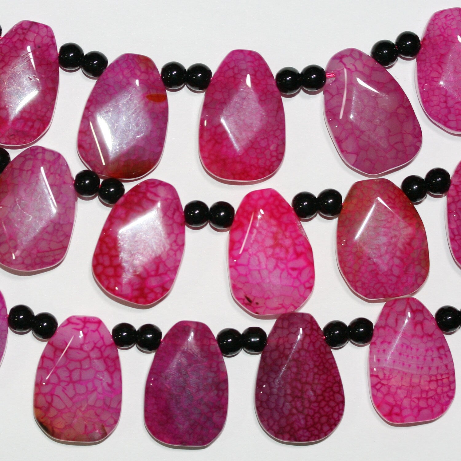 Cuentas facetadas de ágata fucsia de 16" de St. 30 x 20 mm - Hilo de 40 cm.