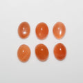 Lote de 6 cabujones ovalados de piedra lunar melocotón de 9 x 7 mm. (6 piezas)