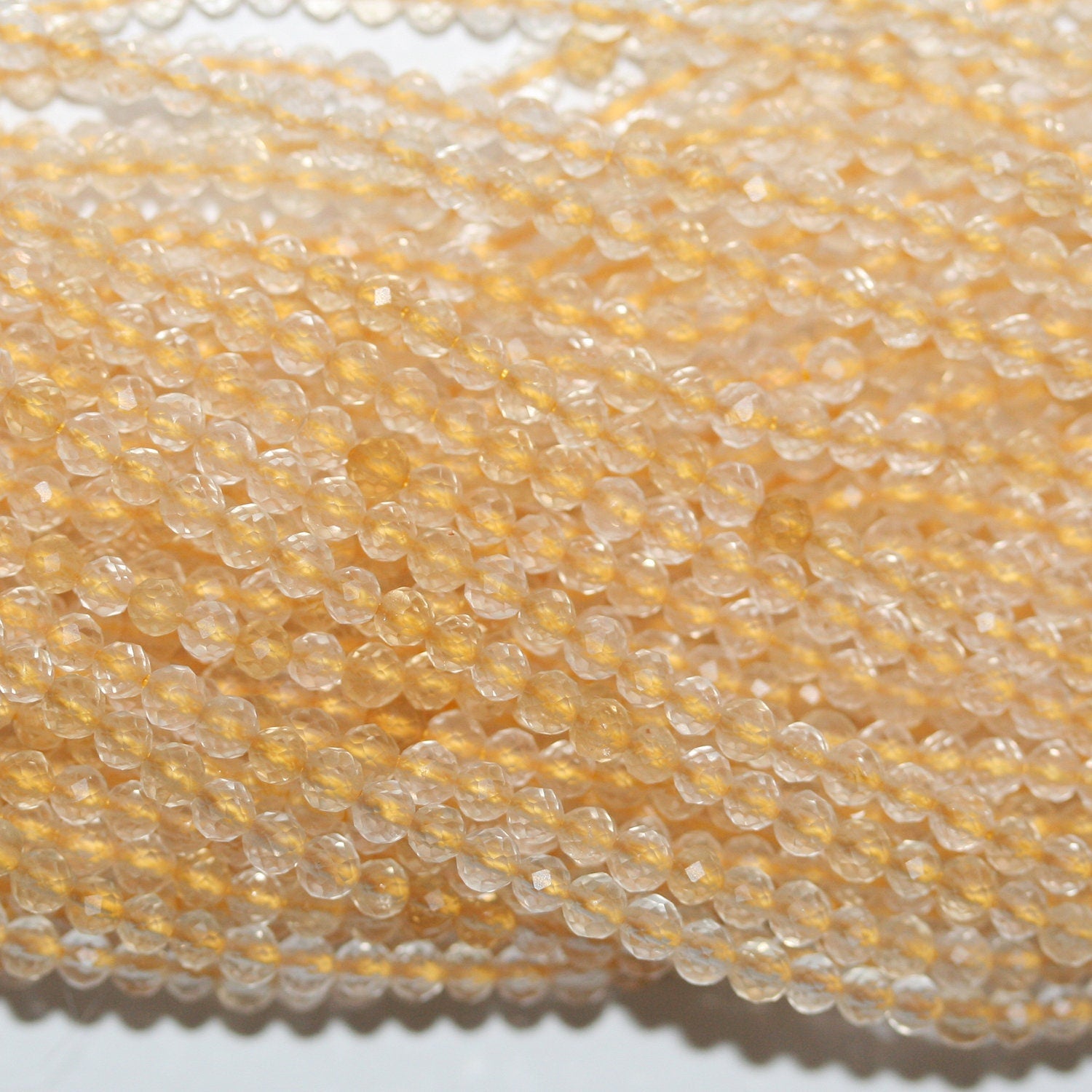 16" Cuentas Redondas Facetadas de Citrino 2.5mm.-Hilo 40cm.