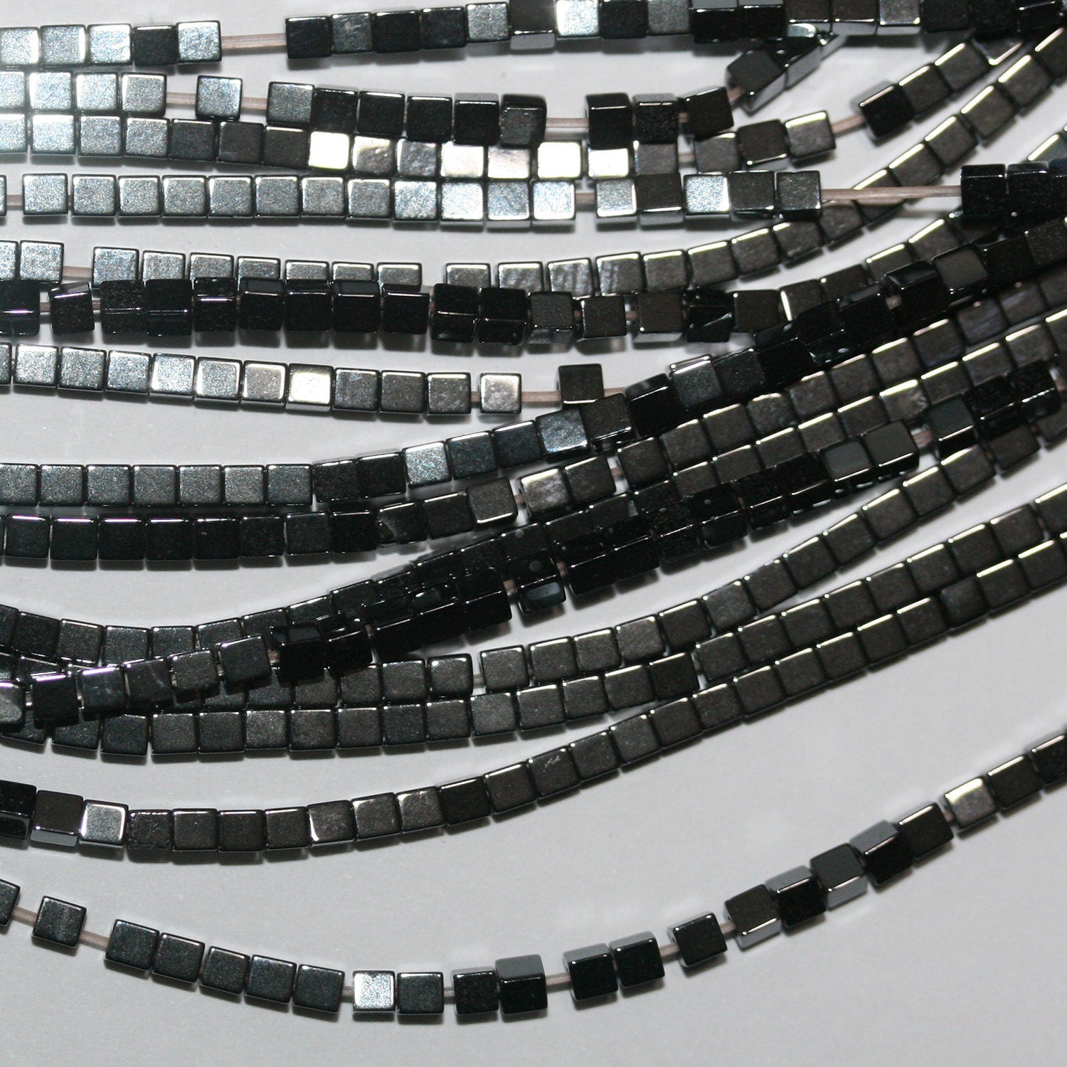 116" St Hematite Smooth Cube Beads 2mm.-Strand 40cm.