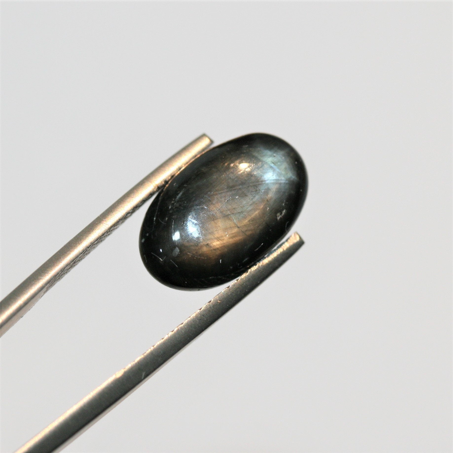 Natural Black Star Sapphire Oval Cabochon 15.3x9.2mm. (9.33ct.) - Top Quality