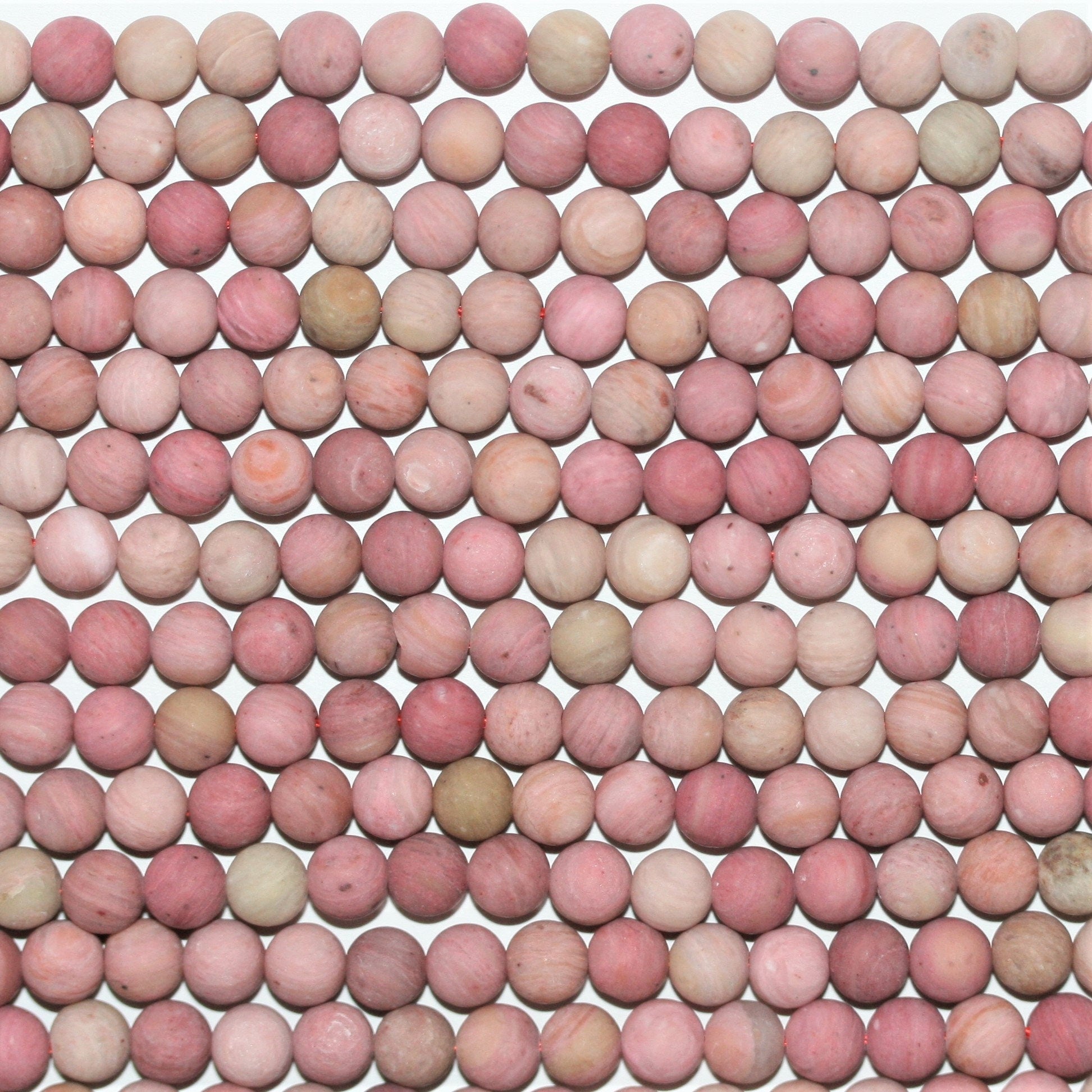 Perles rondes lisses en rhodonite mate 6 mm - Fil de 39 cm.