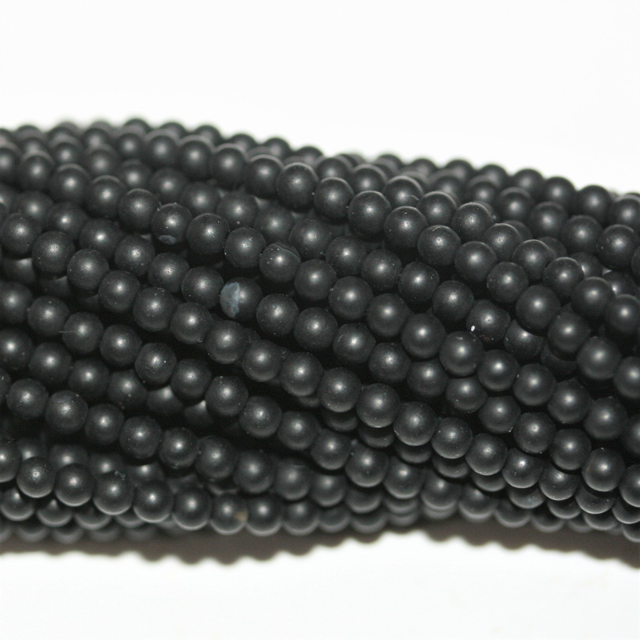 Perles rondes lisses en onyx finition mate 2 mm - Fil de 40 cm.