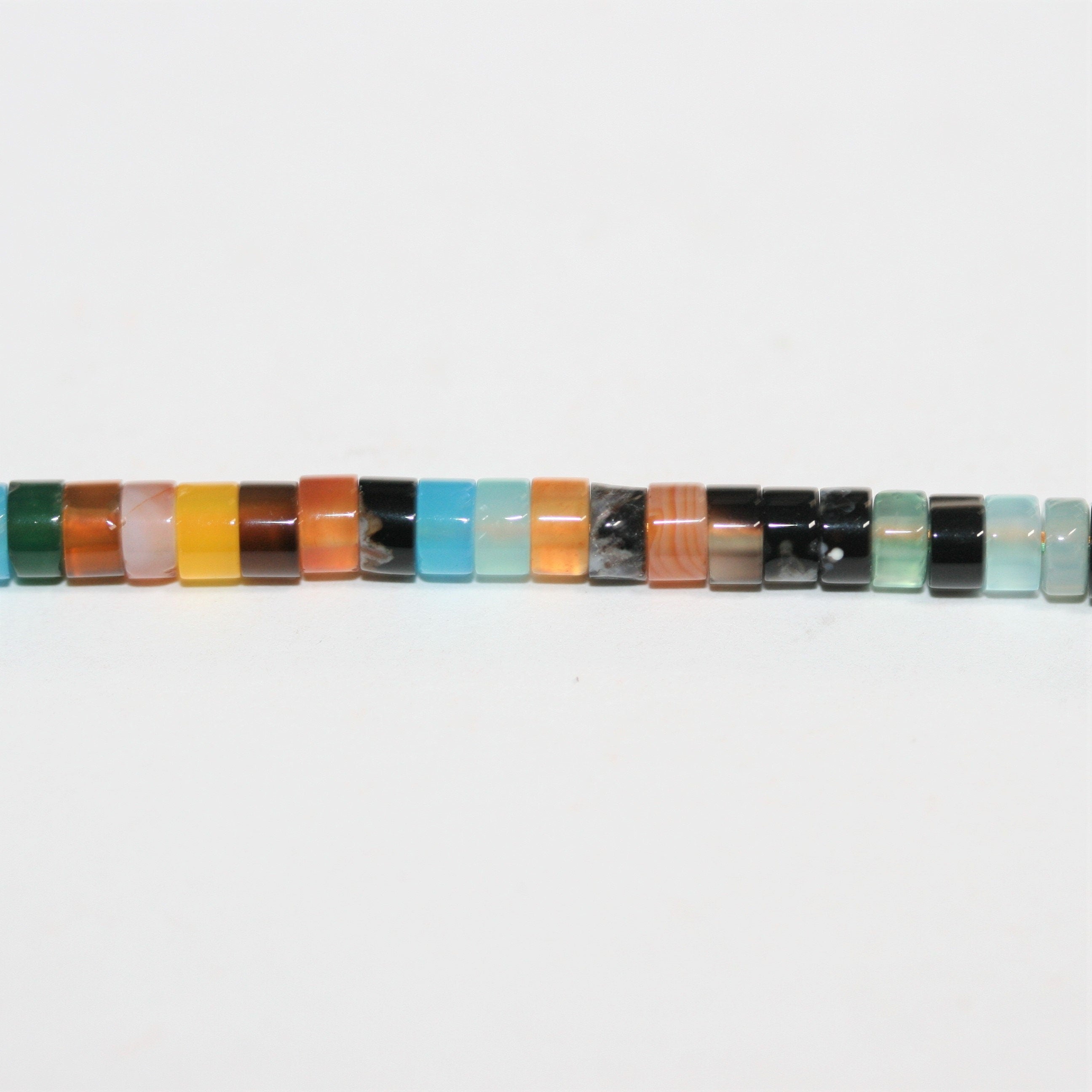 Perles disques lisses en pierre multicolore 15" 4x2mm.- Brin 39cm.