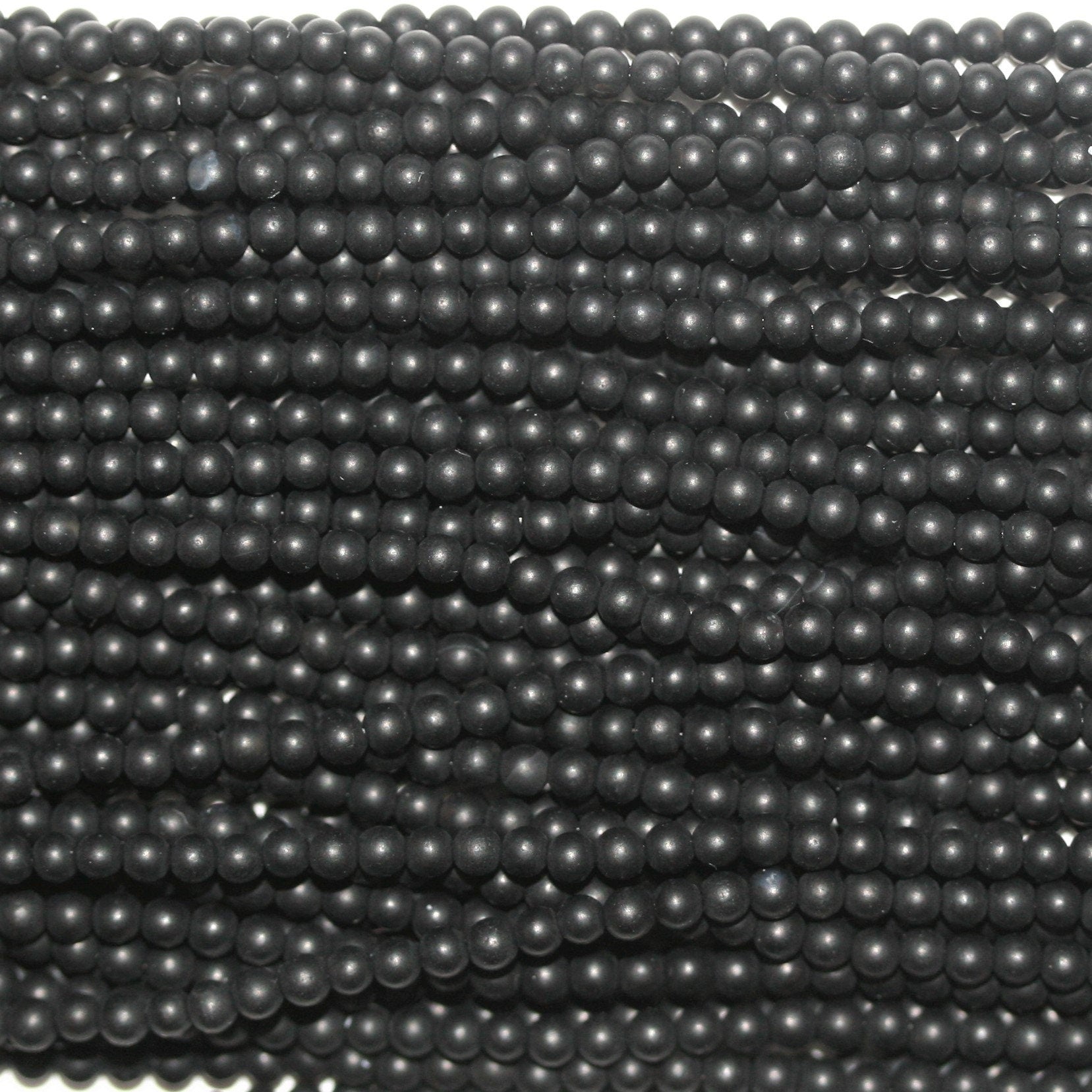 Perles rondes lisses en onyx finition mate 2 mm - Fil de 40 cm.
