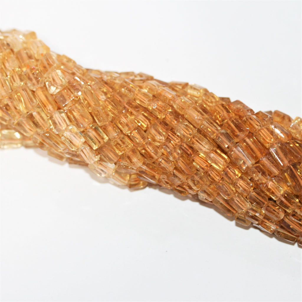 15" Perles de citrine facettées prismatiques 7x5mm.- Brin 38cm.