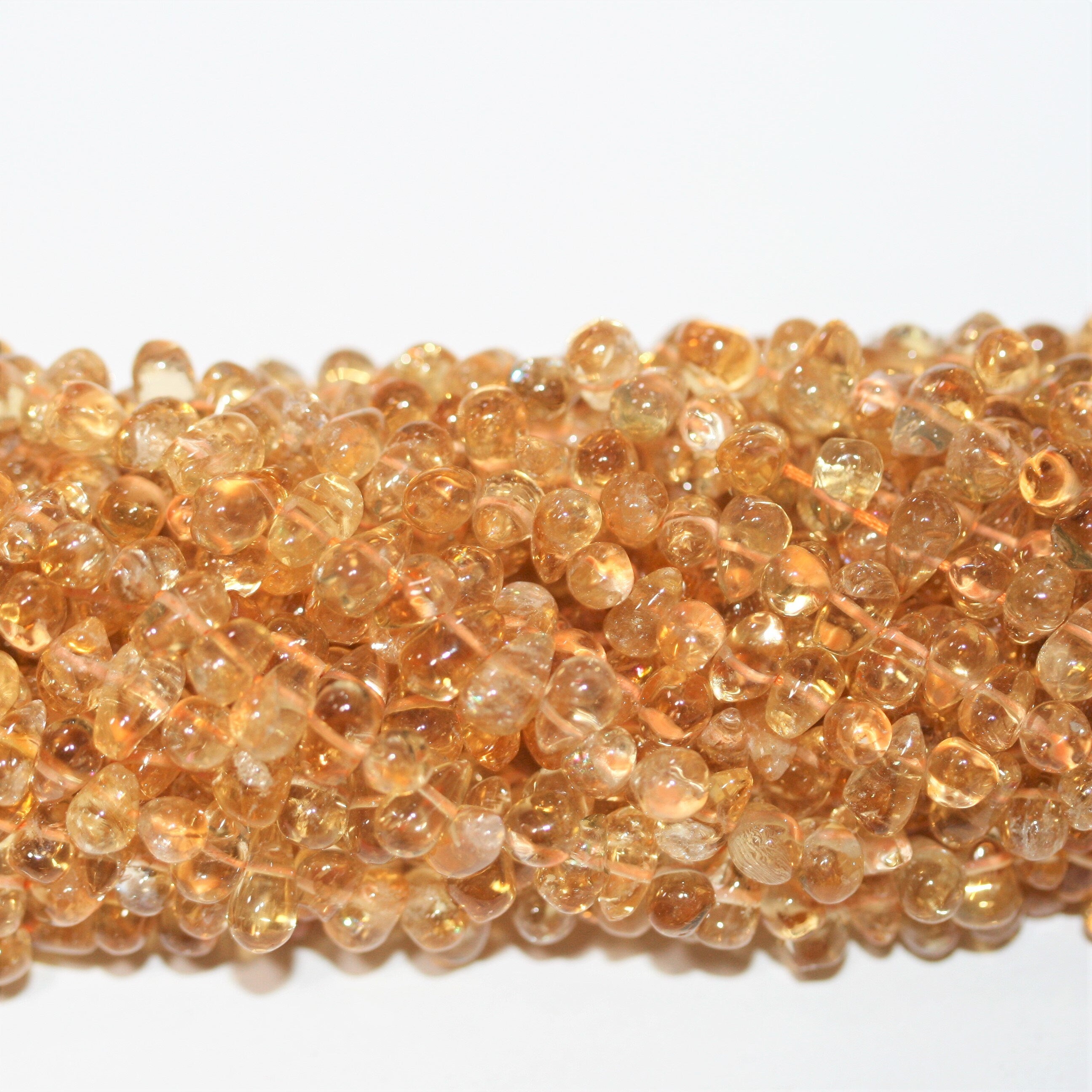 14" St Citrine Smooth Drop Beads 8x5mm. Approx.- Strand 36cm.