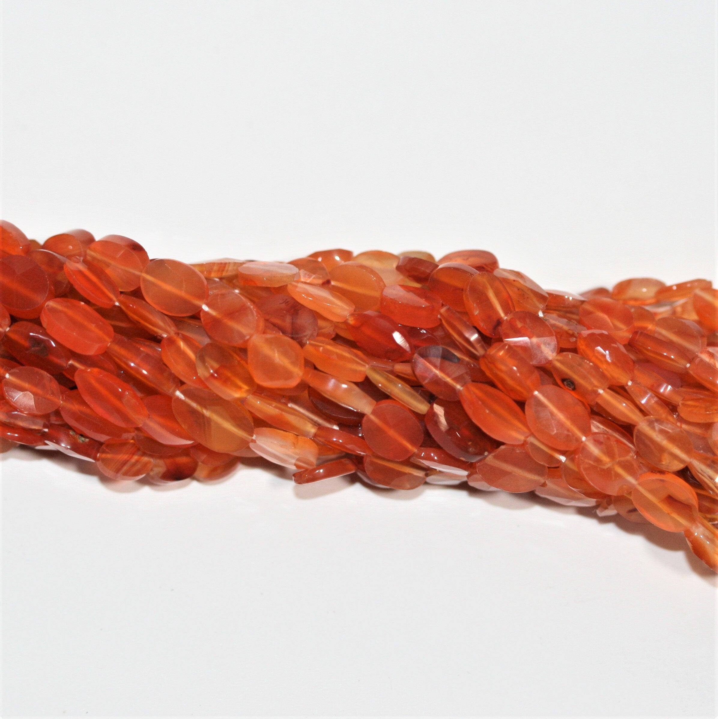 13" St Carnelian Faceted Oval Beads 9x6mm. Approx.- Strand 33cm.