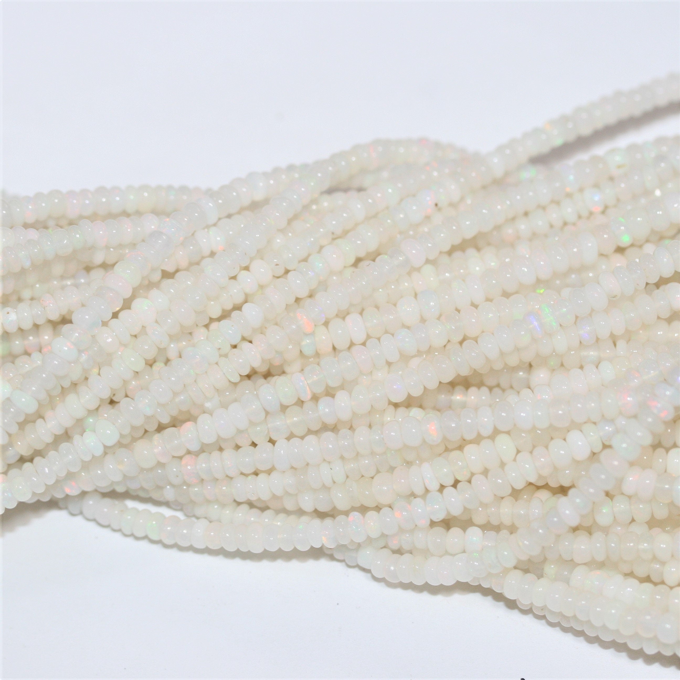 Cuentas redondas lisas graduadas de ópalo etíope de San Etiopía de 16", 3 x 1,5 - 4,5 x 3 mm, tira de 42 cm.