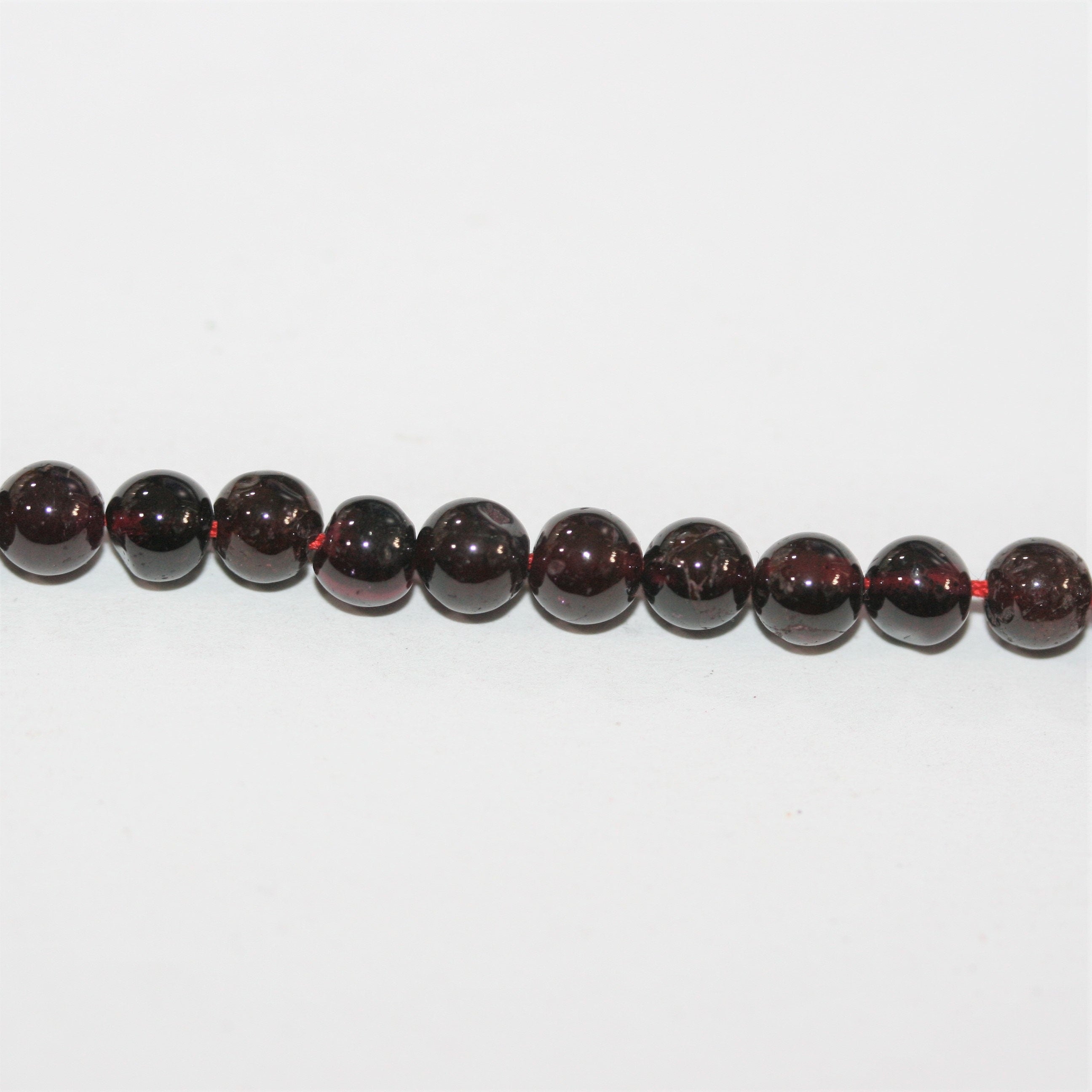 13" St Garnet Smooth Round Beads 5mm.- Strand 33cm.