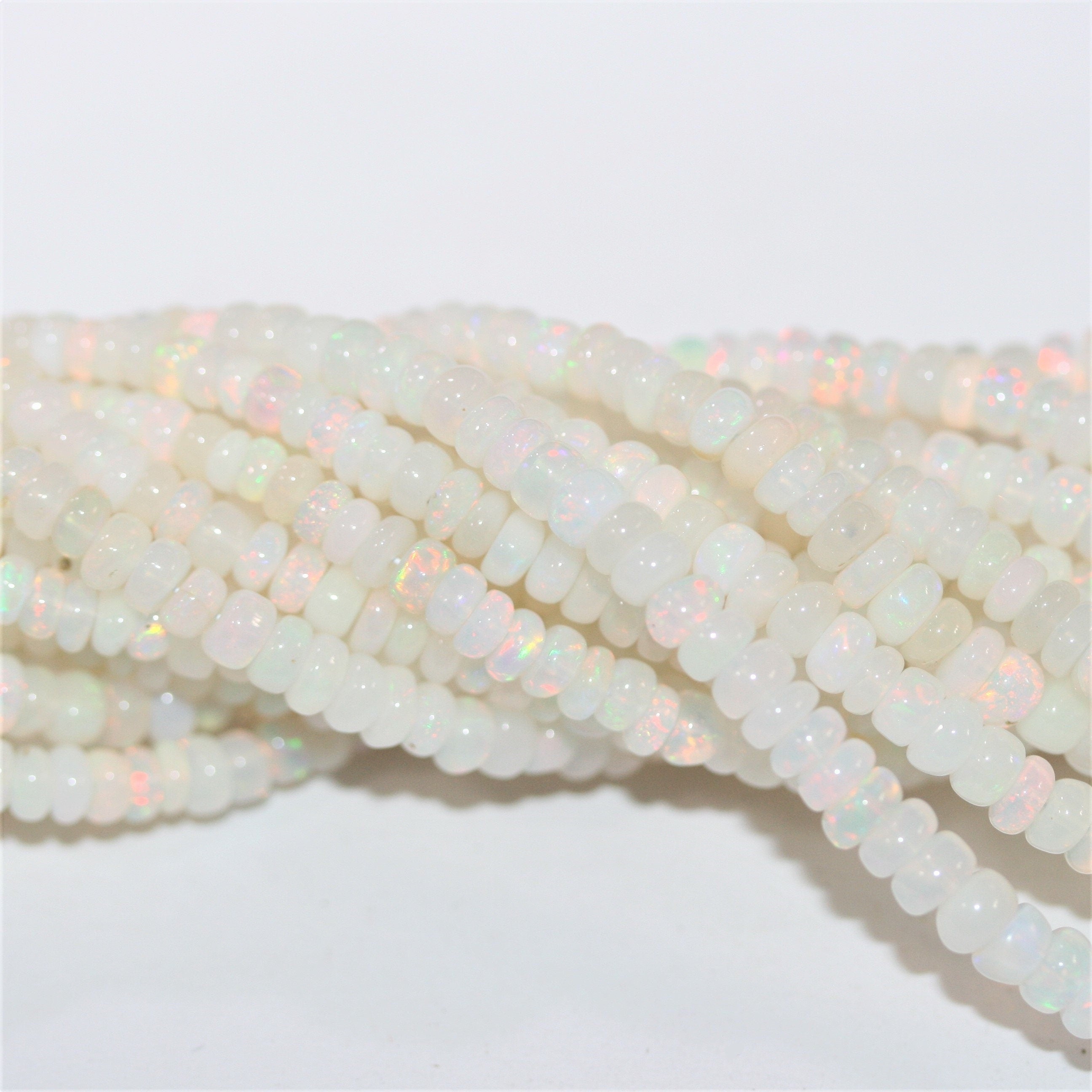 16" St Ethiopian Opal Graduated Smooth Rondelle Beads 3x2- 7x3.5mm.- Strand 40cm.- Item. 13252 - Hard Gems