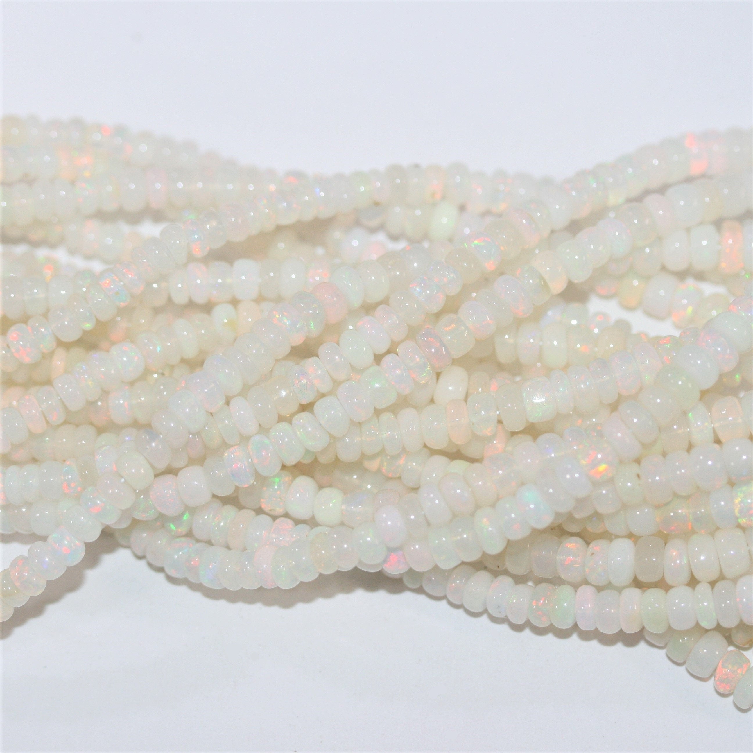 16" St Ethiopian Opal Graduated Smooth Rondelle Beads 3x2- 7x3.5mm.- Strand 40cm.- Item. 13252 - Hard Gems