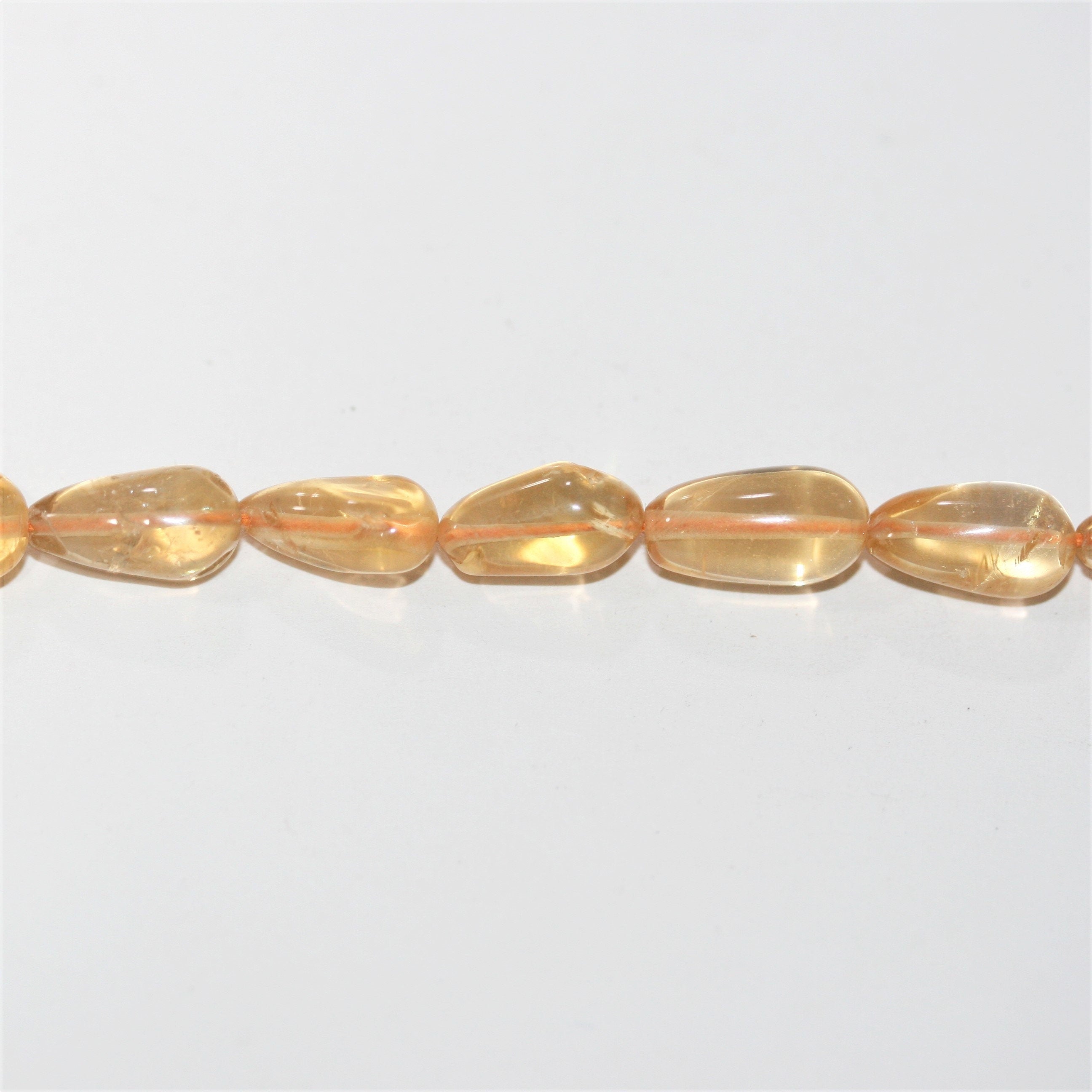 14" St Citrine Smooth Drop Beads 11x5mm. Approx.- Strand 37cm.