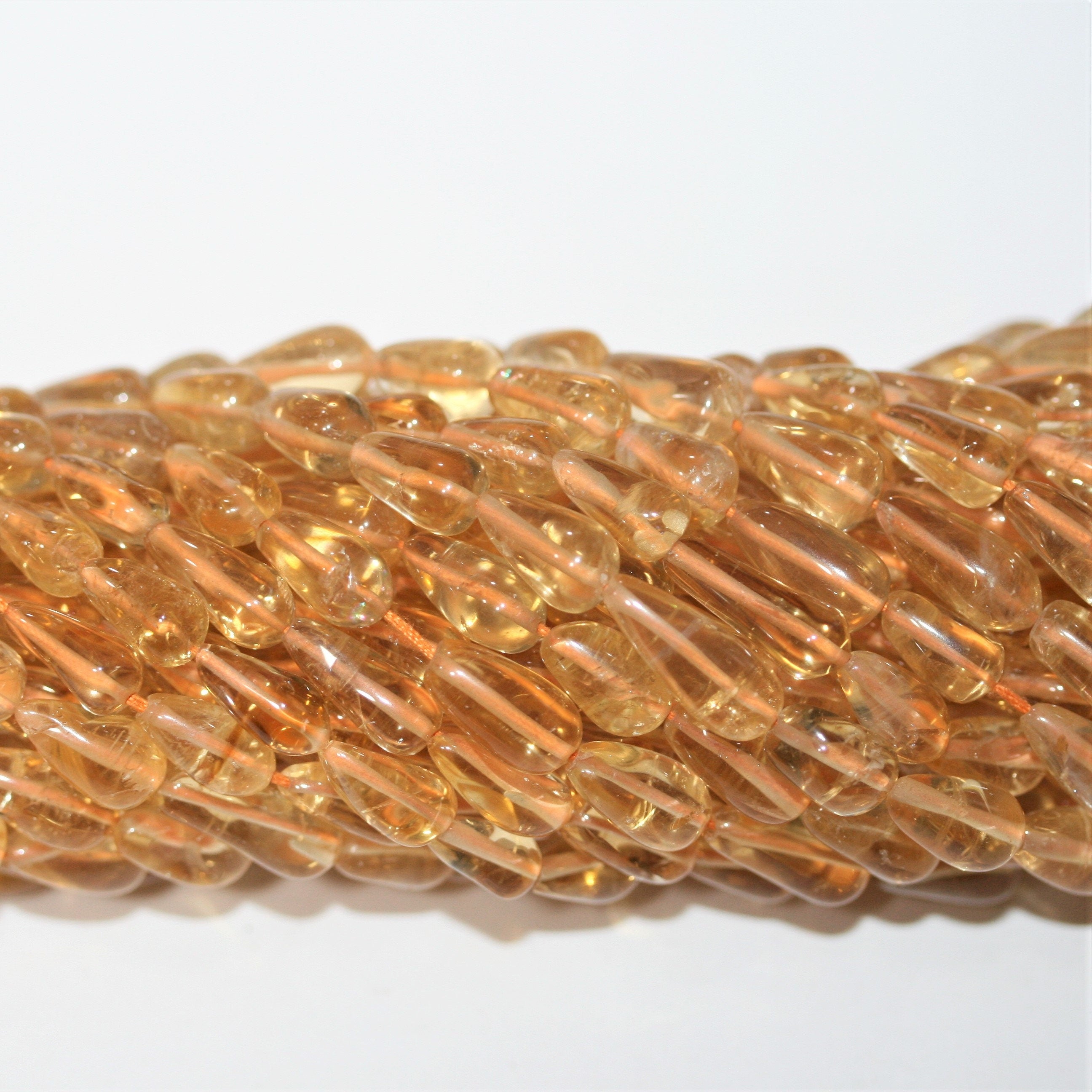14" St Citrine Smooth Drop Beads 11x5mm. Approx.- Strand 37cm.