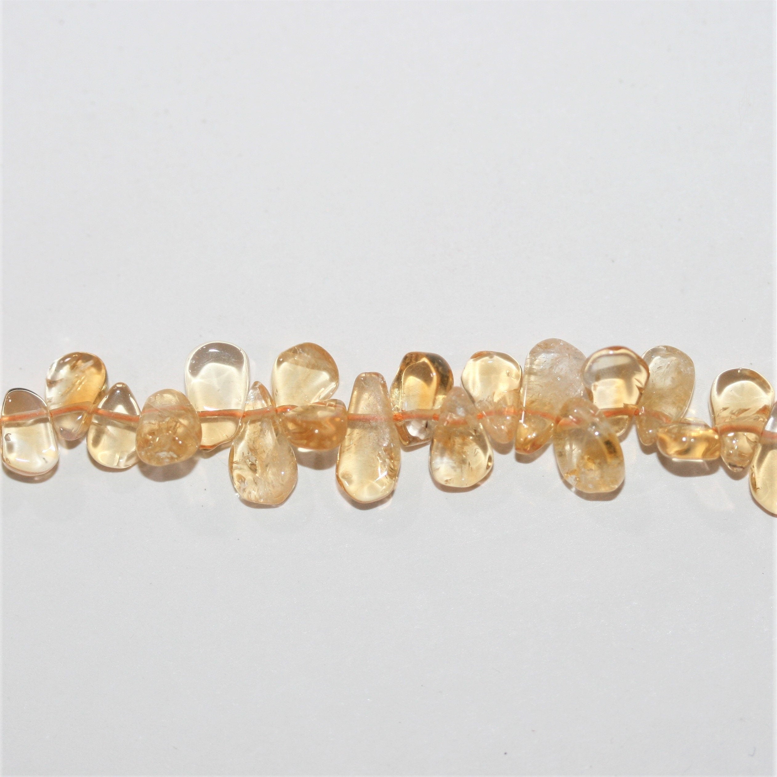 Perles plates lisses en citrine St de 15 pouces (8 x 5 mm). Longueur approximative du brin : 38 cm.