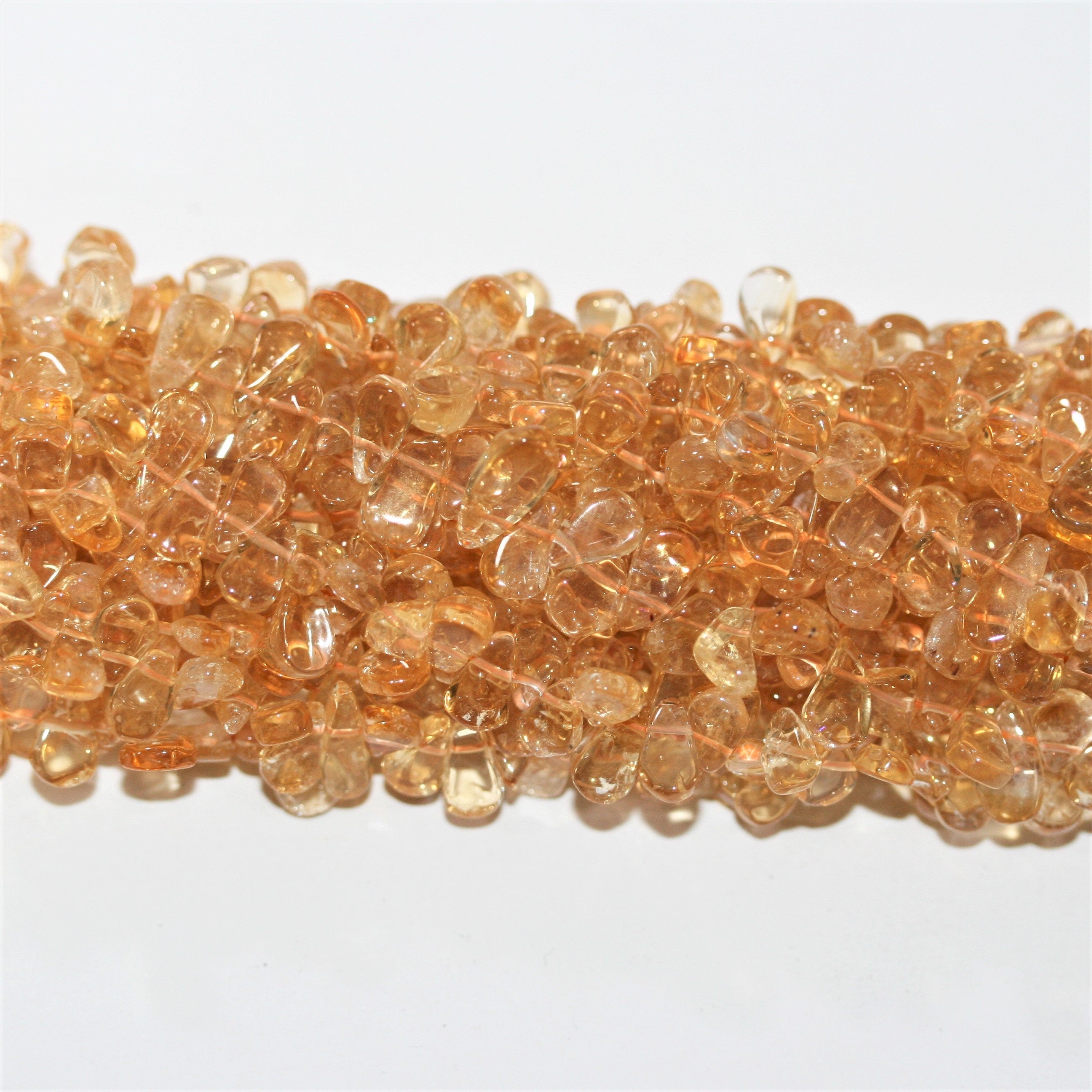 Perles plates lisses en citrine St de 15 pouces (8 x 5 mm). Longueur approximative du brin : 38 cm.