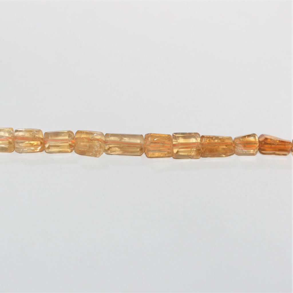 15" Perles de citrine facettées prismatiques 7x5mm.- Brin 38cm.