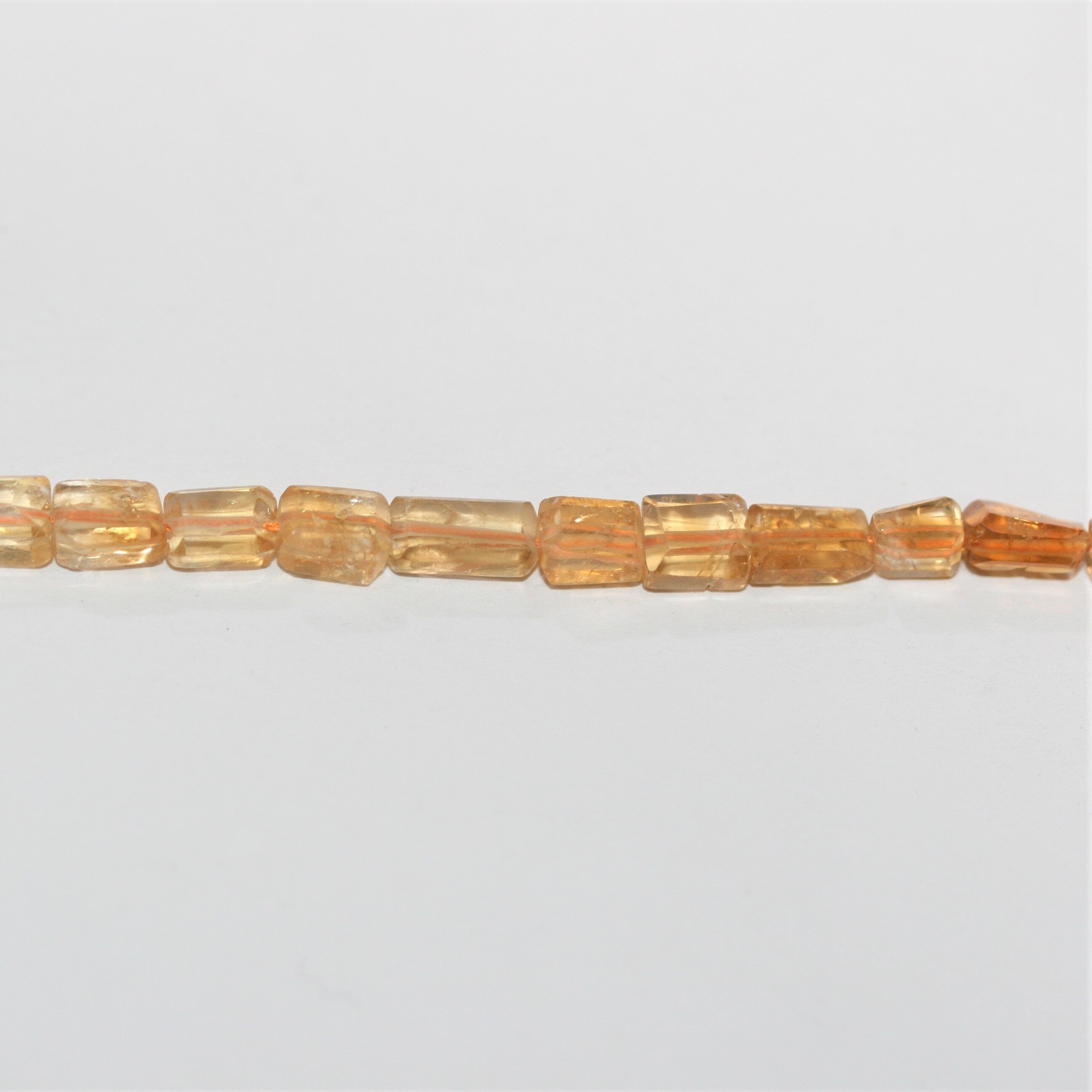 15" Perles de citrine facettées prismatiques 7x5mm.- Brin 38cm.