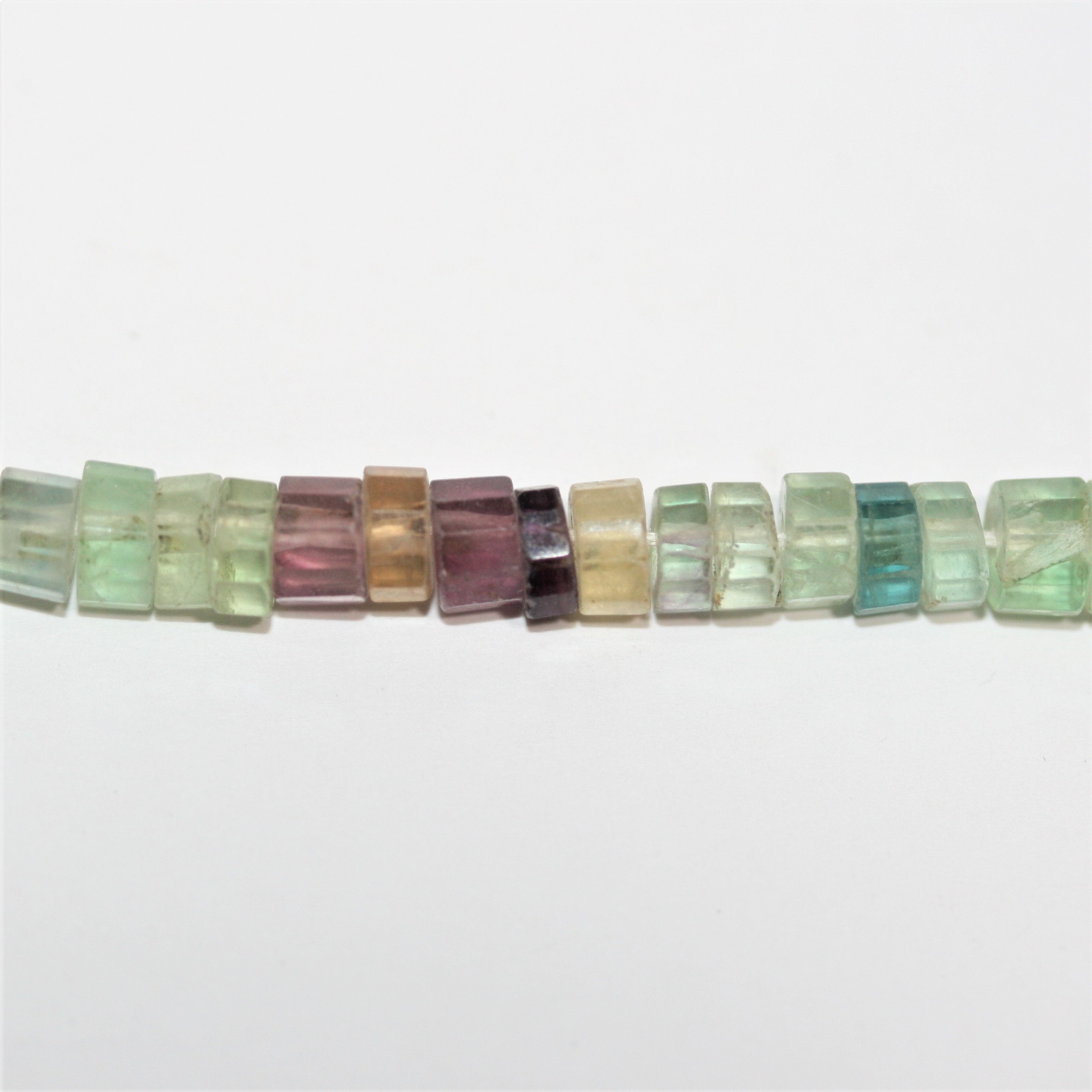 13" St Fluorite Faceted Disc Beads 6x3mm.- Strand 33cm.