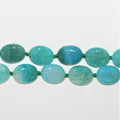 Perles ovales lisses en agate bleue 20x15mm.- Brin 36cm.