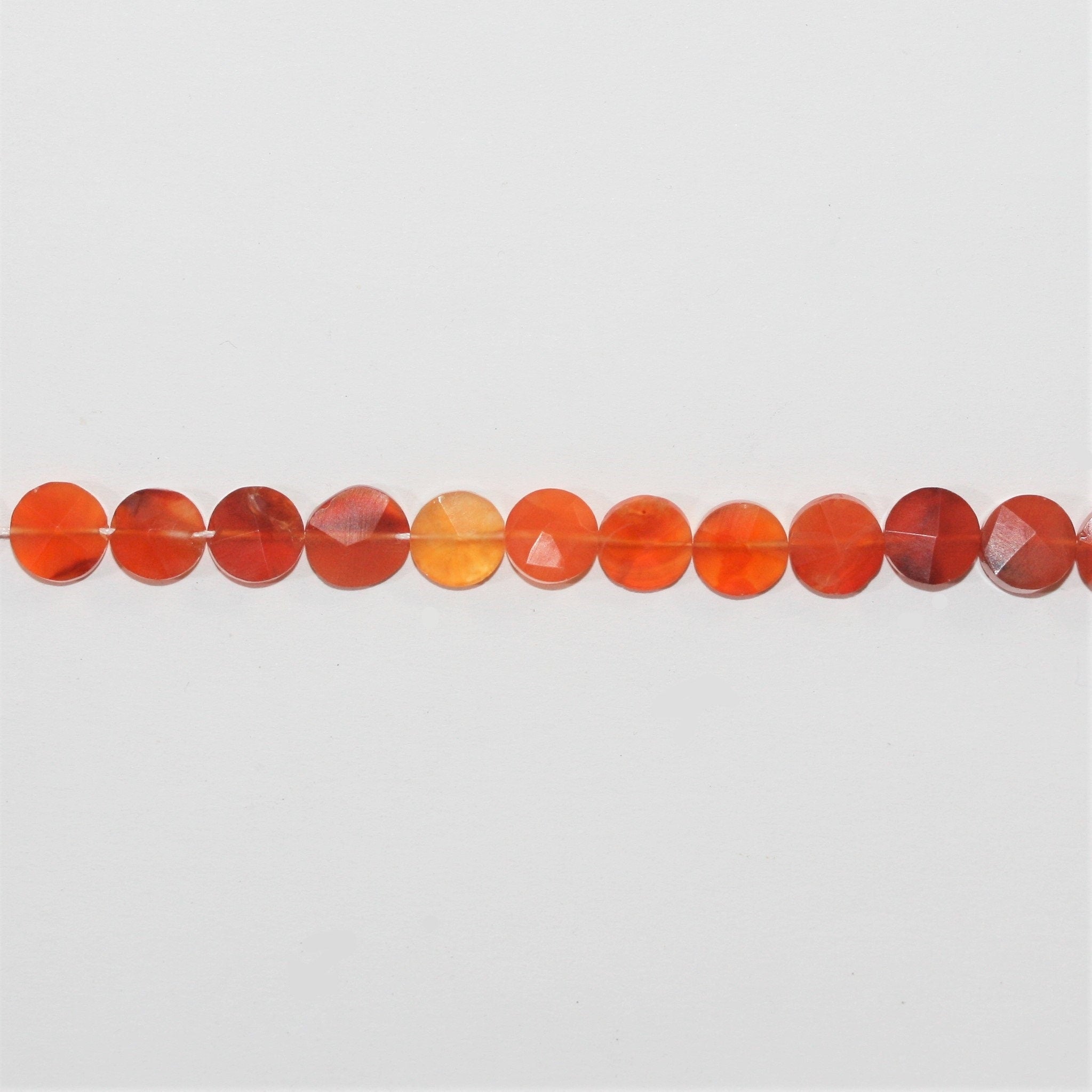13" St Carnelian Faceted Coin Beads 7mm. Approx.- Strand 33cm.