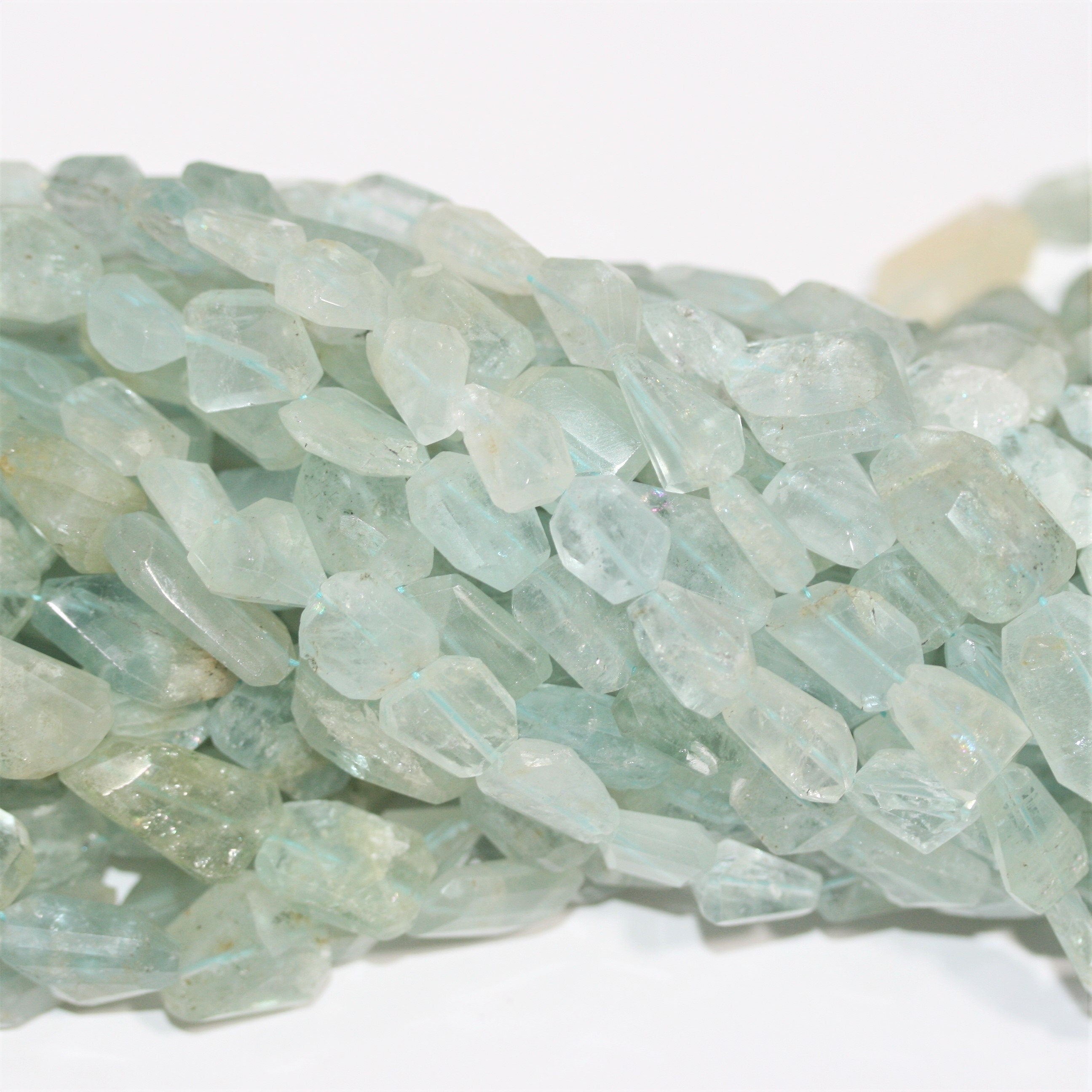 13" St Aquamarine Faceted Nugget Beads 10x8-20x12mm. Approx.- Strand 33cm.