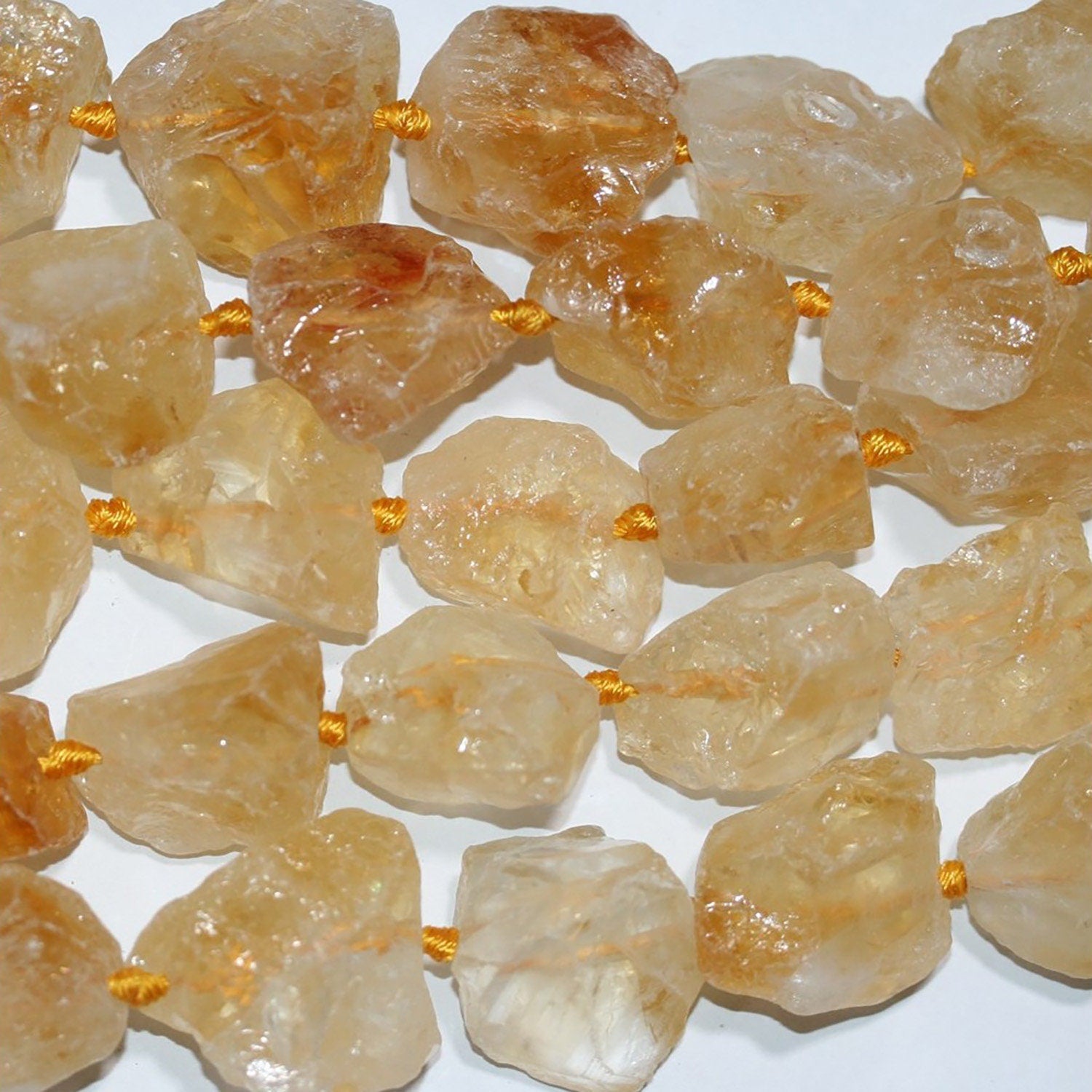 Cuentas de citrino sin pulir de 16", 22-25 mm aprox., tira de 40 cm.