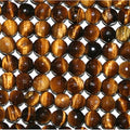 Perles rondes à facettes œil de tigre St de 16 mm - Fil de 39 cm