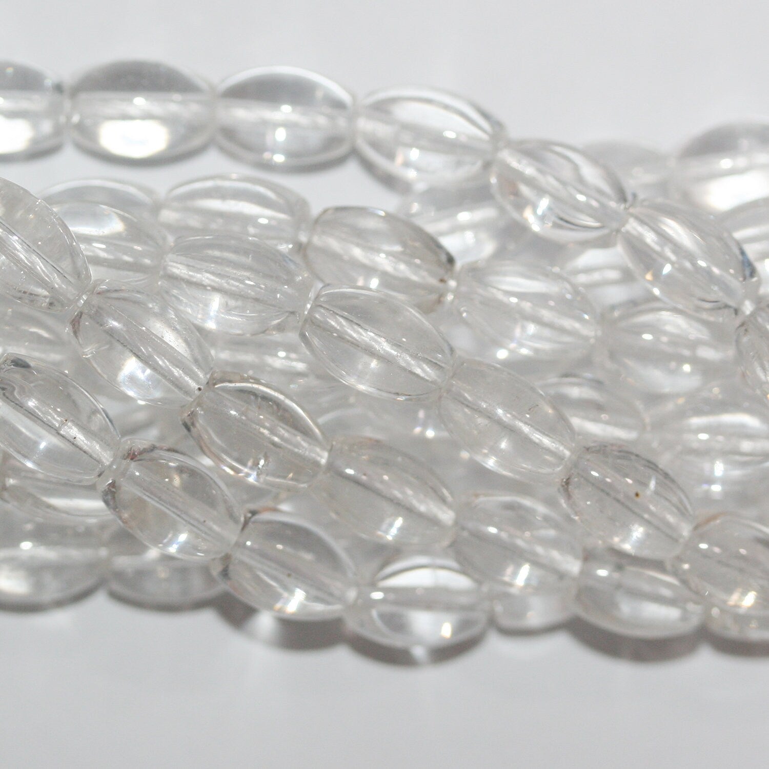 Cuentas de barril liso de cuarzo cristal de roca de 16" 10 x 6 mm - Hilo de 40 cm.