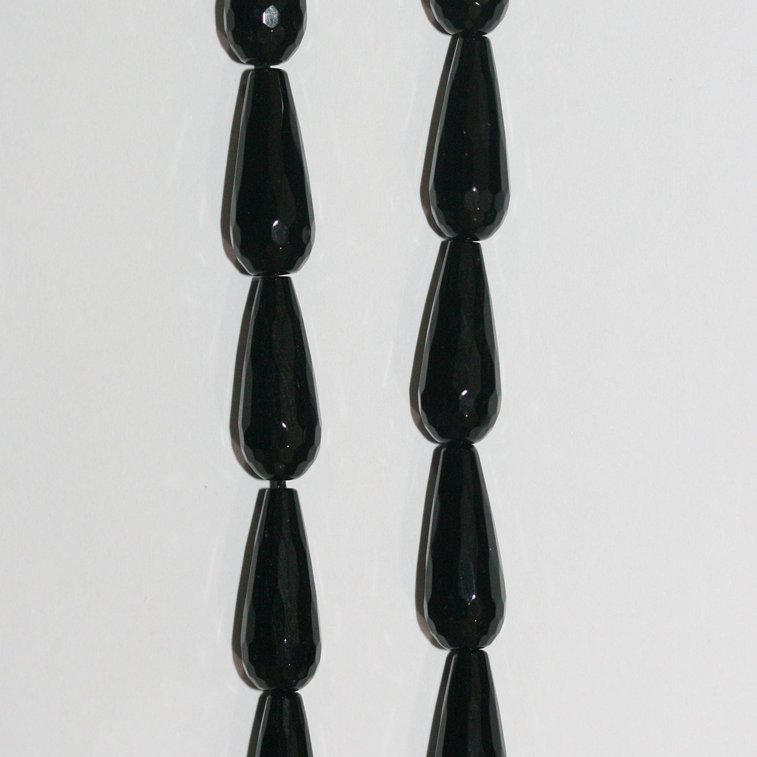 Cuentas de ónix facetado de 16" de St., 20 x 8 mm, hilo de 40 cm.