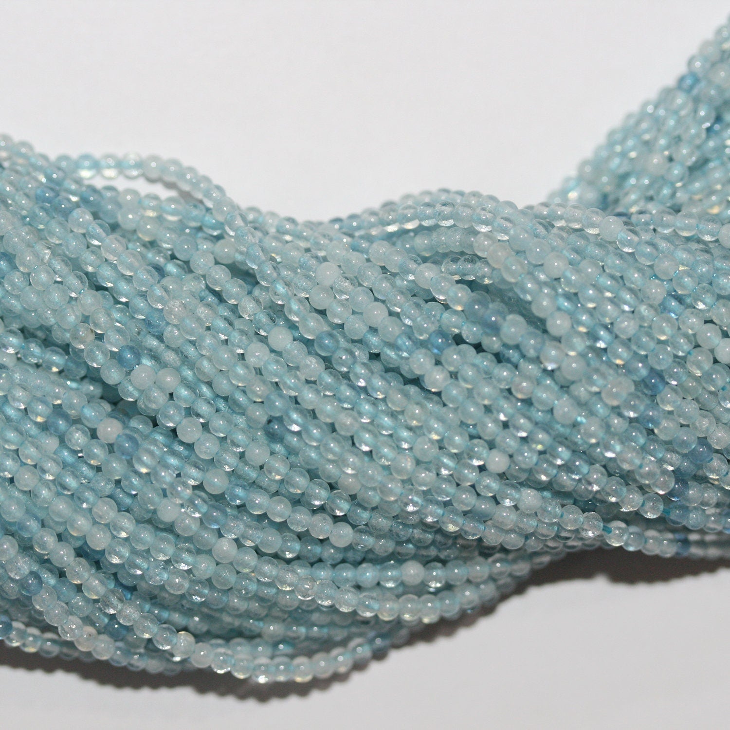 15" Perles rondes lisses en aigue-marine 2 mm.-Rig 39 cm.