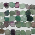 Perles de fluorite St non polies, 15-20 mm environ - Longueur du fil : 39 cm