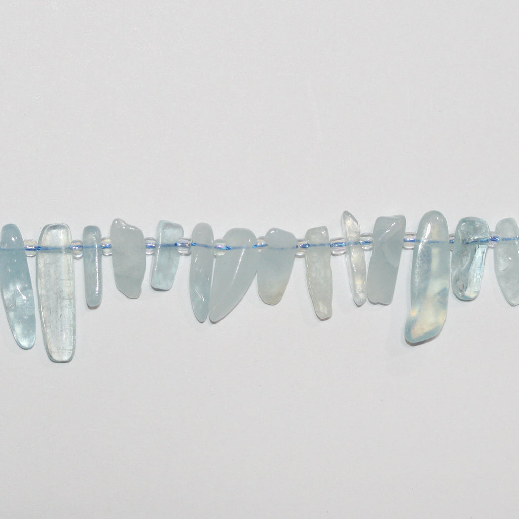 Cuentas irregulares lisas de aguamarina Santa de 16", 8-20 mm aprox., hilo de 40 cm.