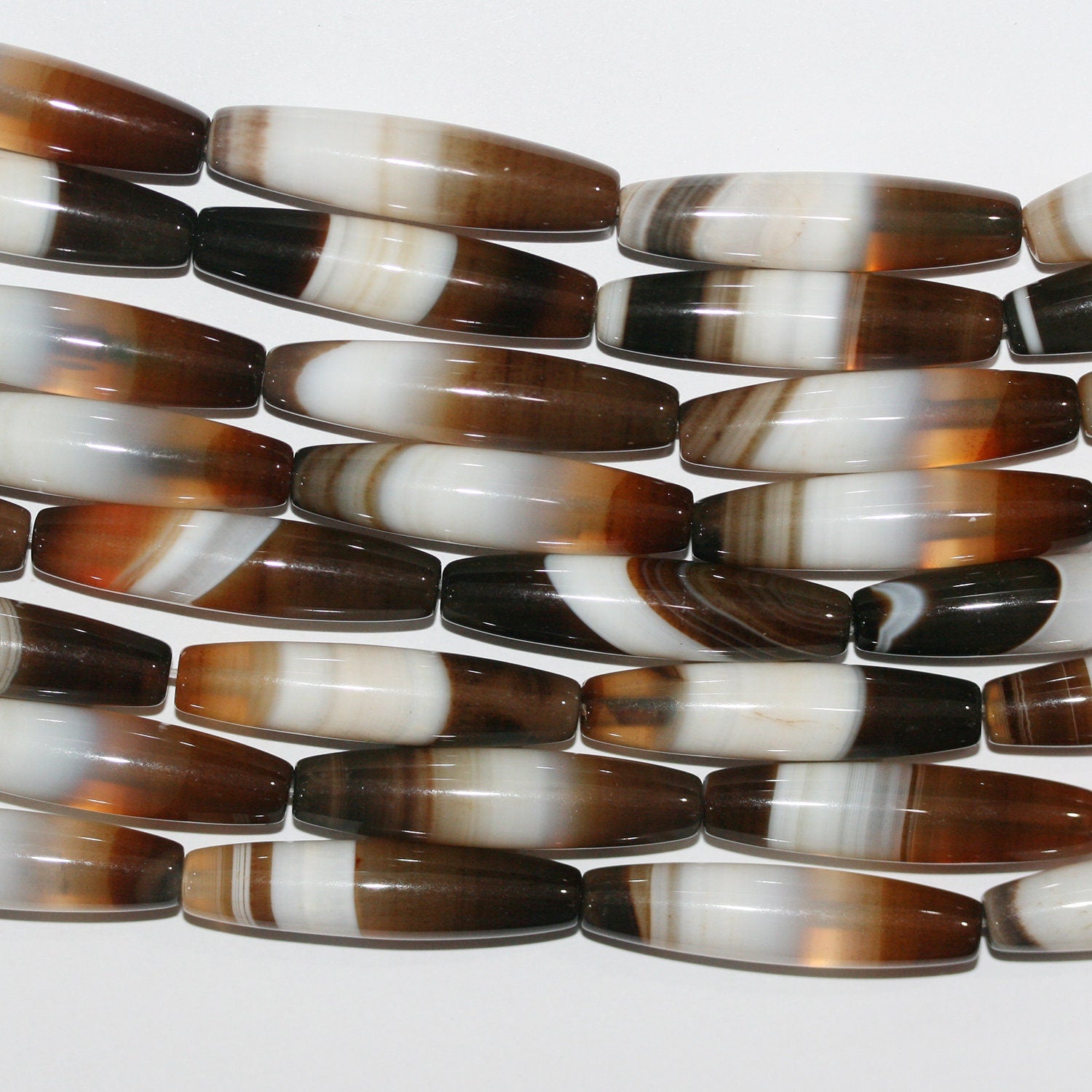 Perles cylindriques lisses en agate à rayures brunes St 15" 34x8mm.-Rig 39cm.