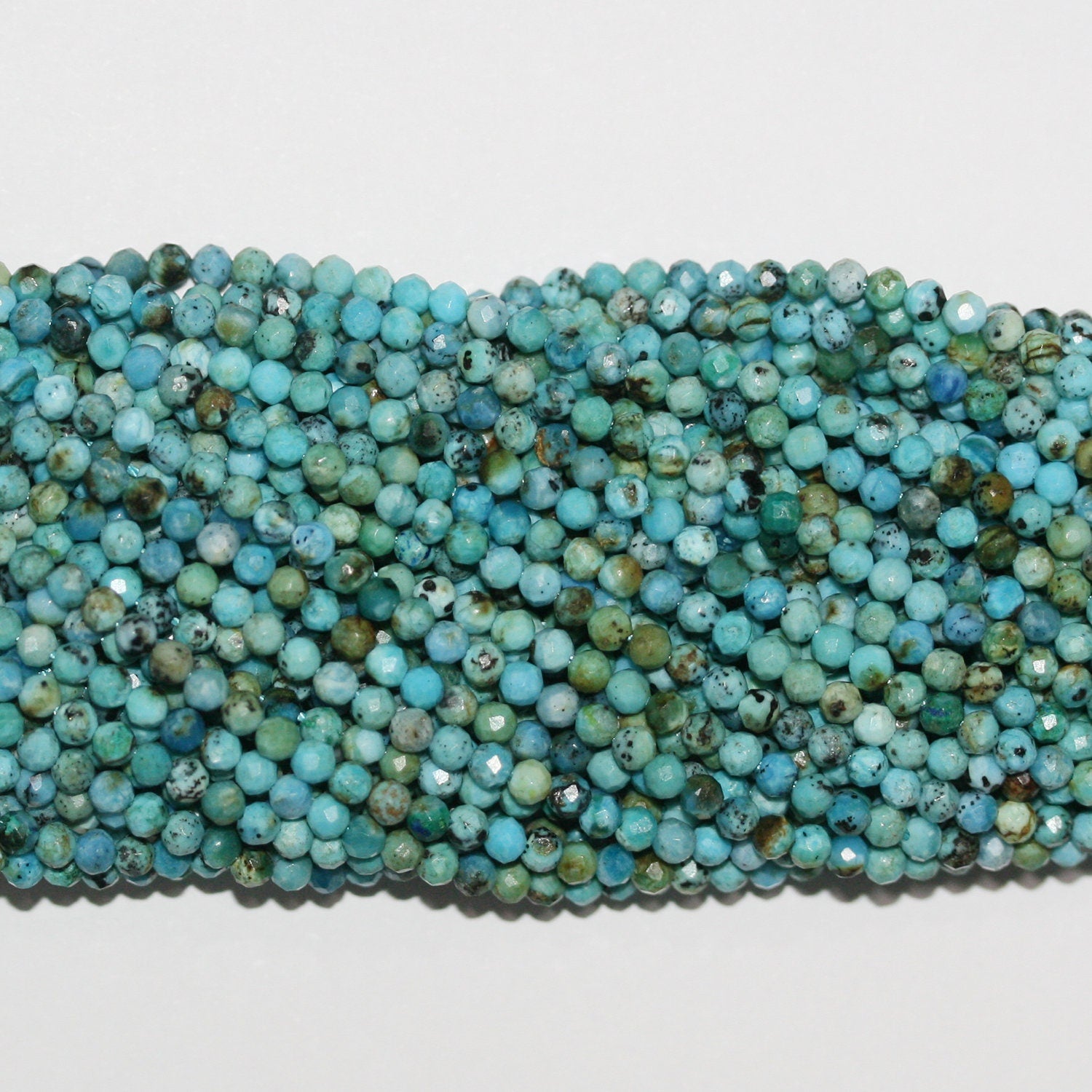 15" Perles rondes à facettes en turquoise St 2,5 mm.-Rig. 39 cm.