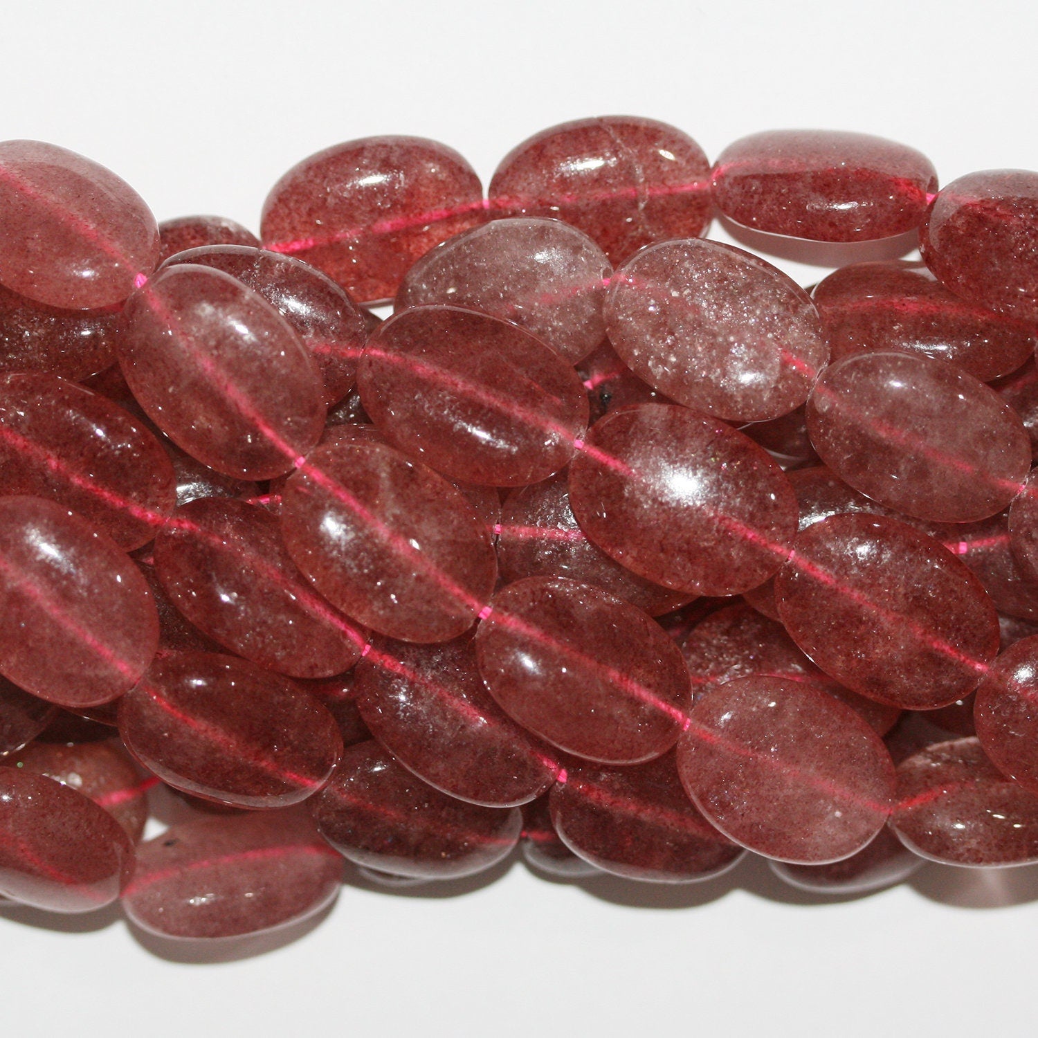 Perles ovales lisses en quartz St. Strawberry 15" 18x13mm.- Brin 39cm.
