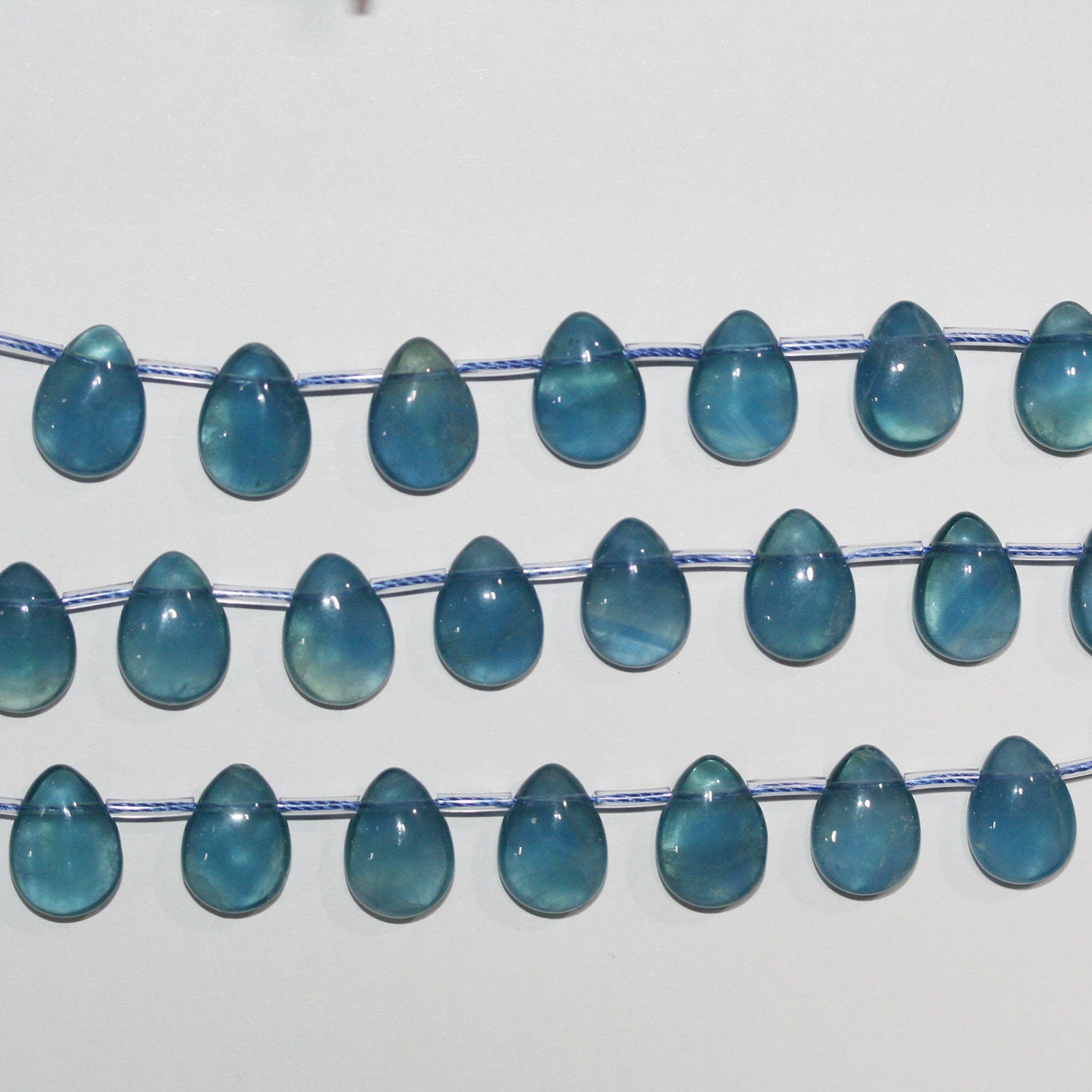 Cuentas de fluorita azul lisas de 8" de 14 x 10 mm - Hilo de 20 cm.