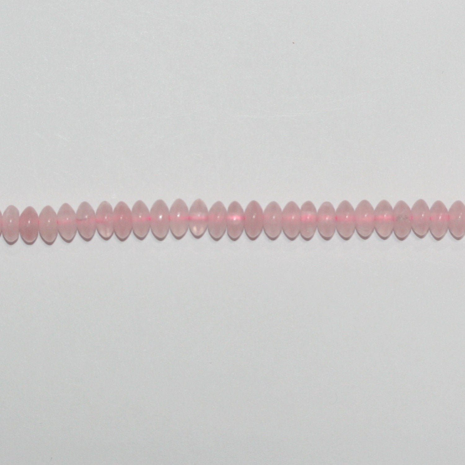 Perles rondelles lisses en quartz rose St 15" 6x3mm.- Brin 39cm.