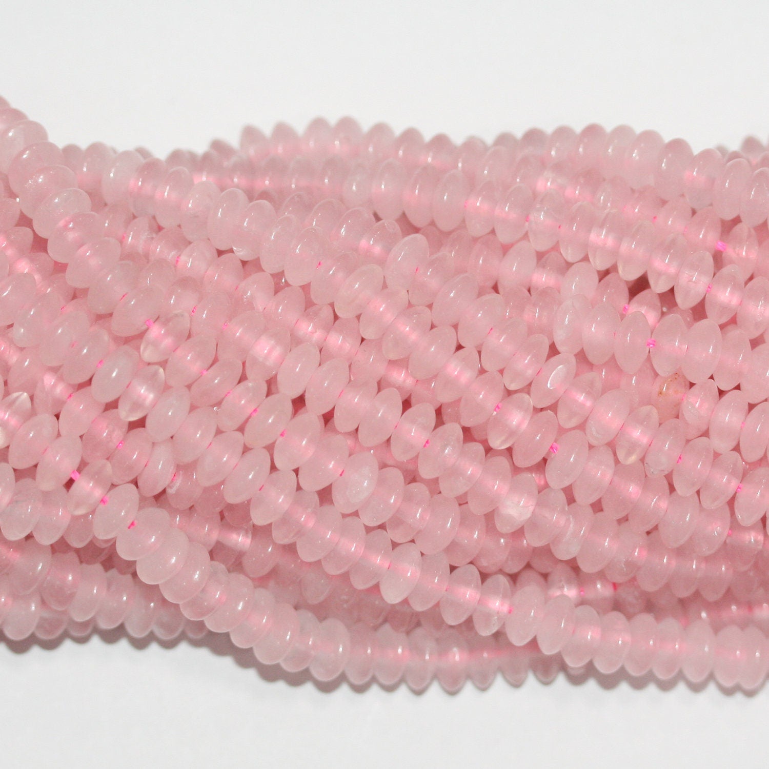 Perles rondelles lisses en quartz rose St 15" 6x3mm.- Brin 39cm.