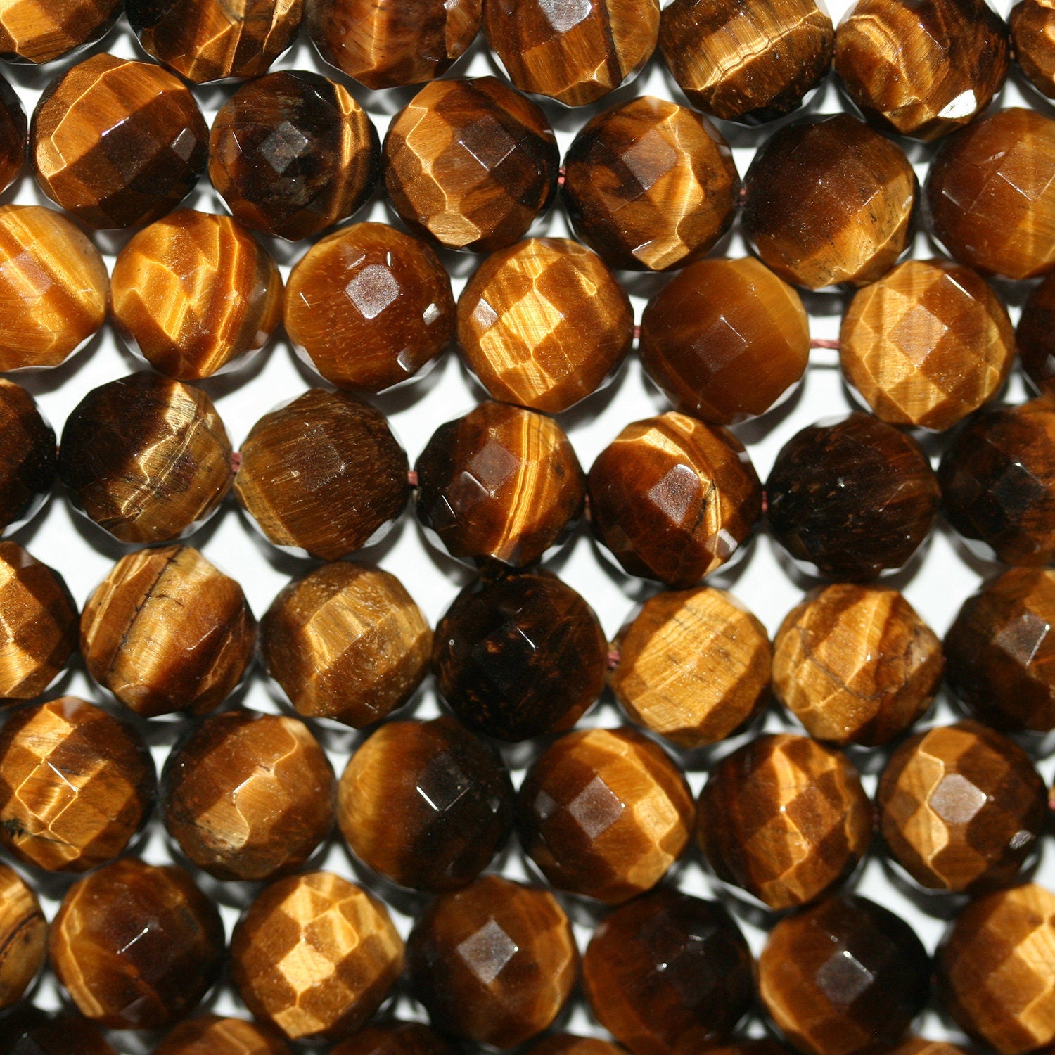 Perles rondes à facettes œil de tigre St 14" 10 mm.-Rig 39 cm.