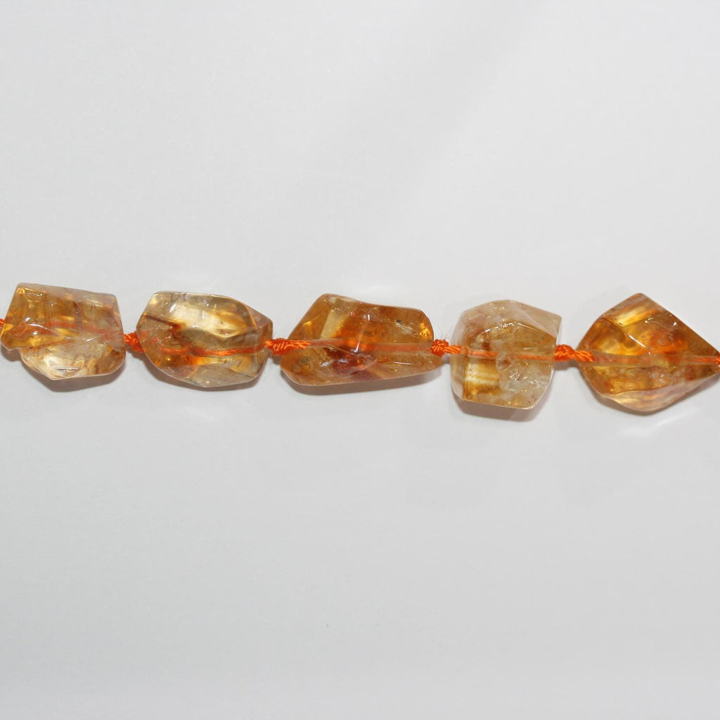 Perles de citrine facettées en forme de pépite de 15 pouces (16 x 12 mm). Longueur approximative du brin : 39 cm.