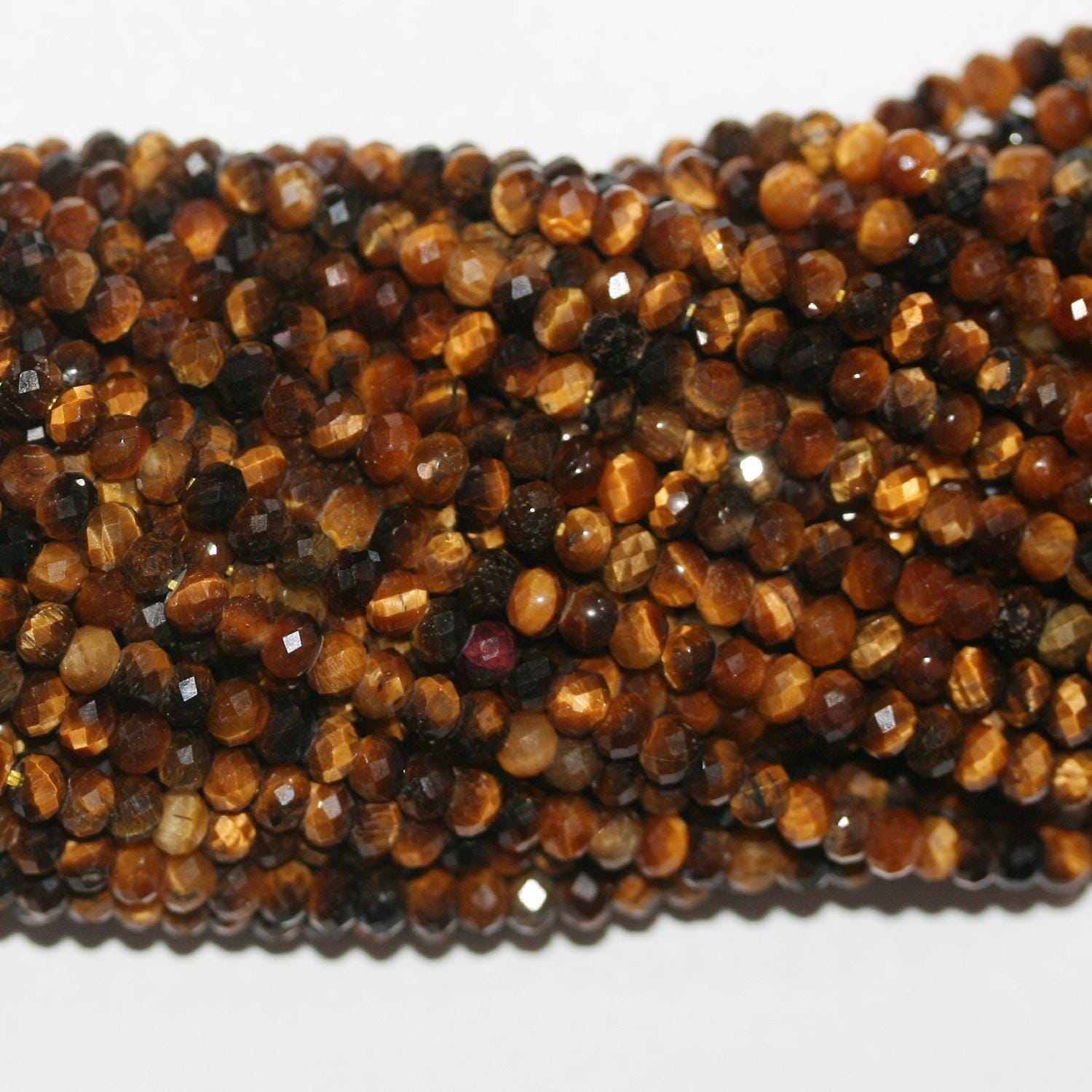Perles rondelles à facettes œil de tigre St 15" 3x2mm- Brin 39cm.