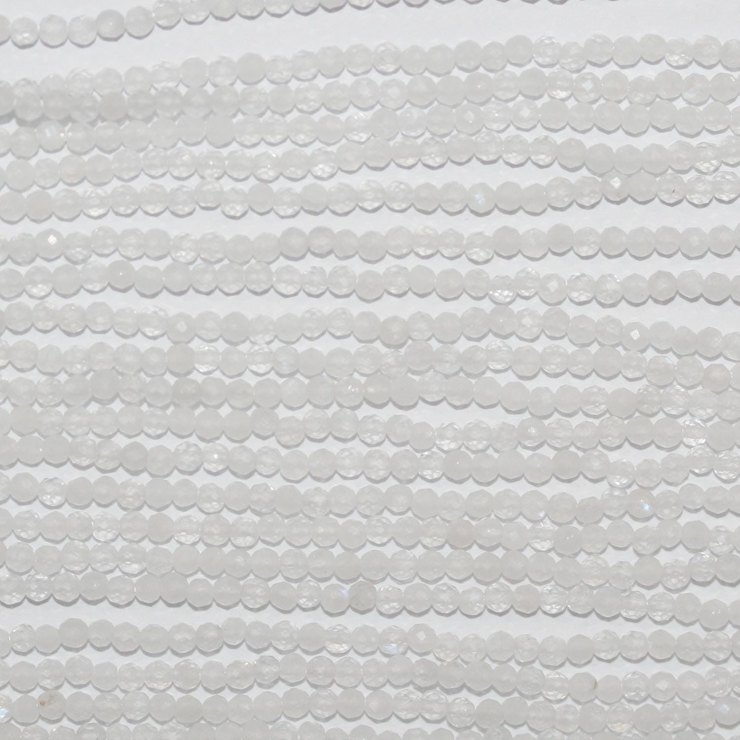 Perles rondes à facettes en pierre de lune St 15" 2 mm.- Brin 39 cm.