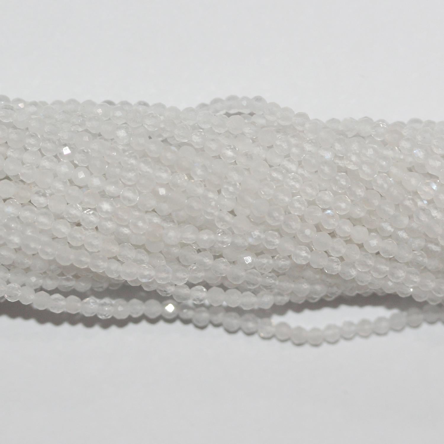 Perles rondes à facettes en pierre de lune St 15" 2 mm.- Brin 39 cm.