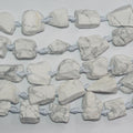 Cuentas de howlita blanca sin pulir de 40 cm, 20-28 mm (aprox.), tira de 40 cm