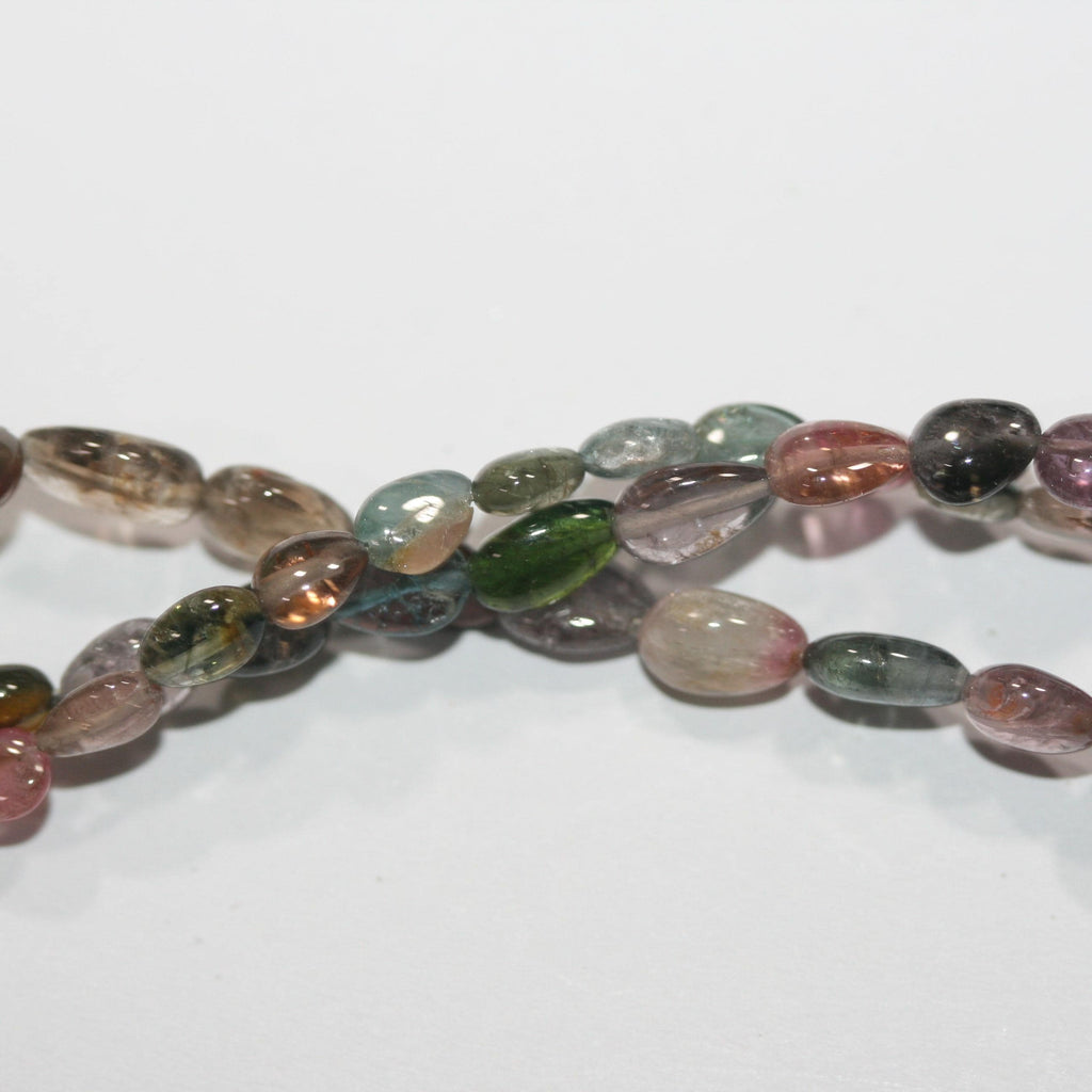 Perles en tourmaline lisses en forme de goutte de 8 pouces (environ 7 x 5 mm). Longueur du fil : 20 cm.