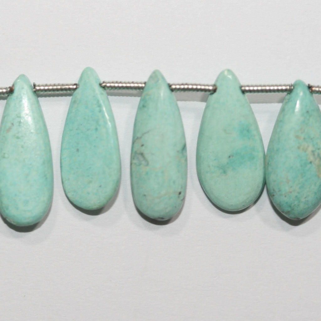 Perles plates lisses en turquoise St de 8 pouces (18 x 8 mm). Longueur du fil : environ 20 cm.